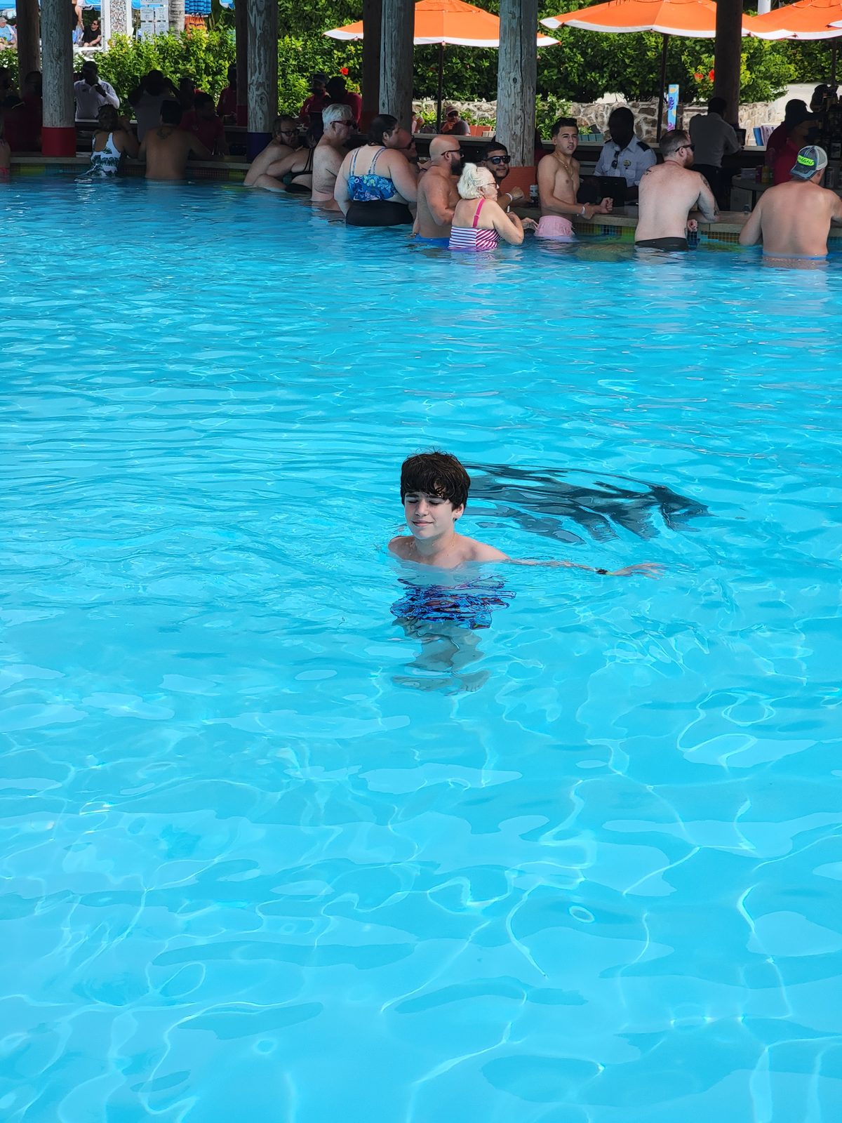 Thomas swimming in the Oasis Lagoon pool