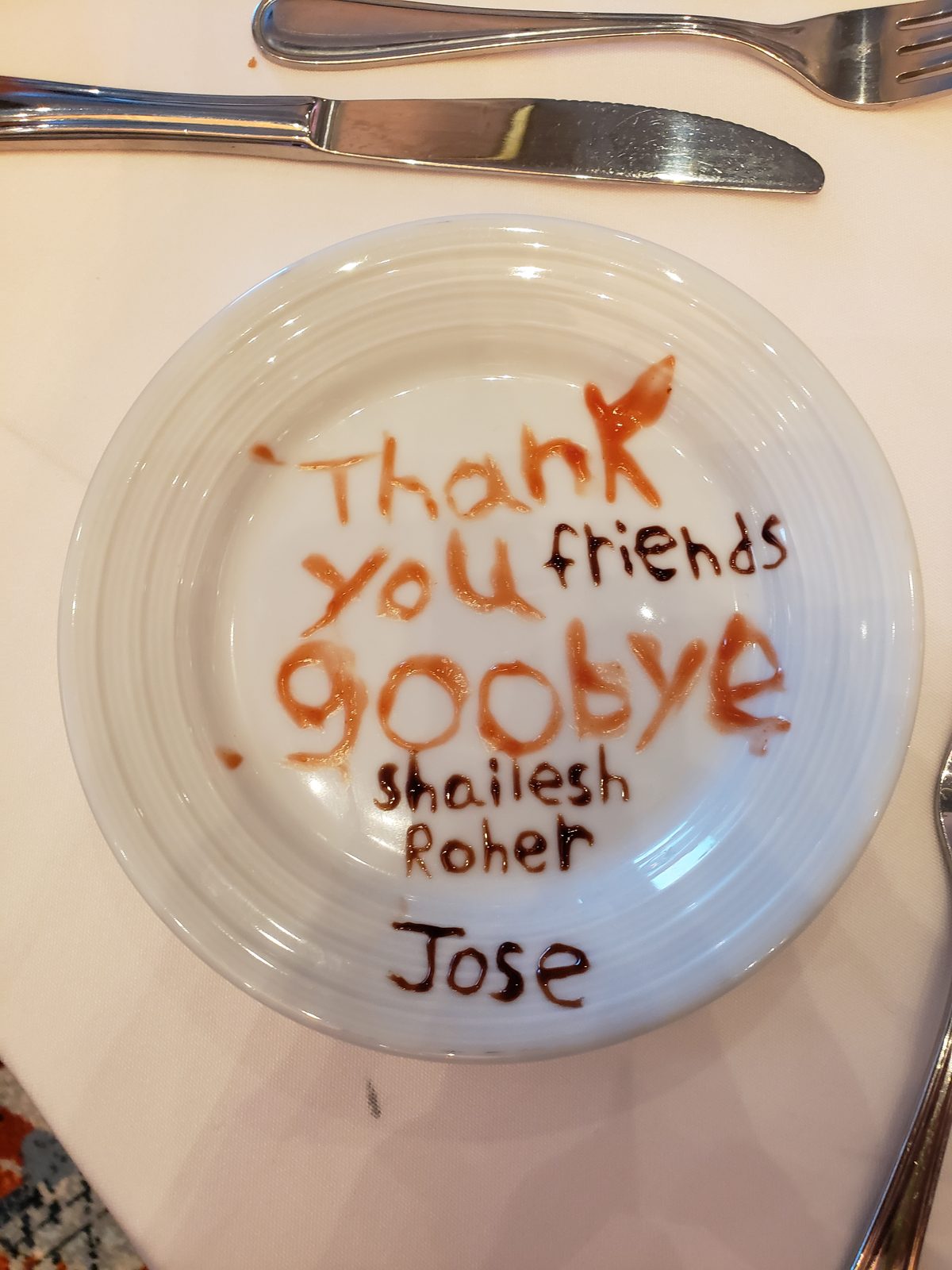 The crew's goodbye message on Lisa's plate
