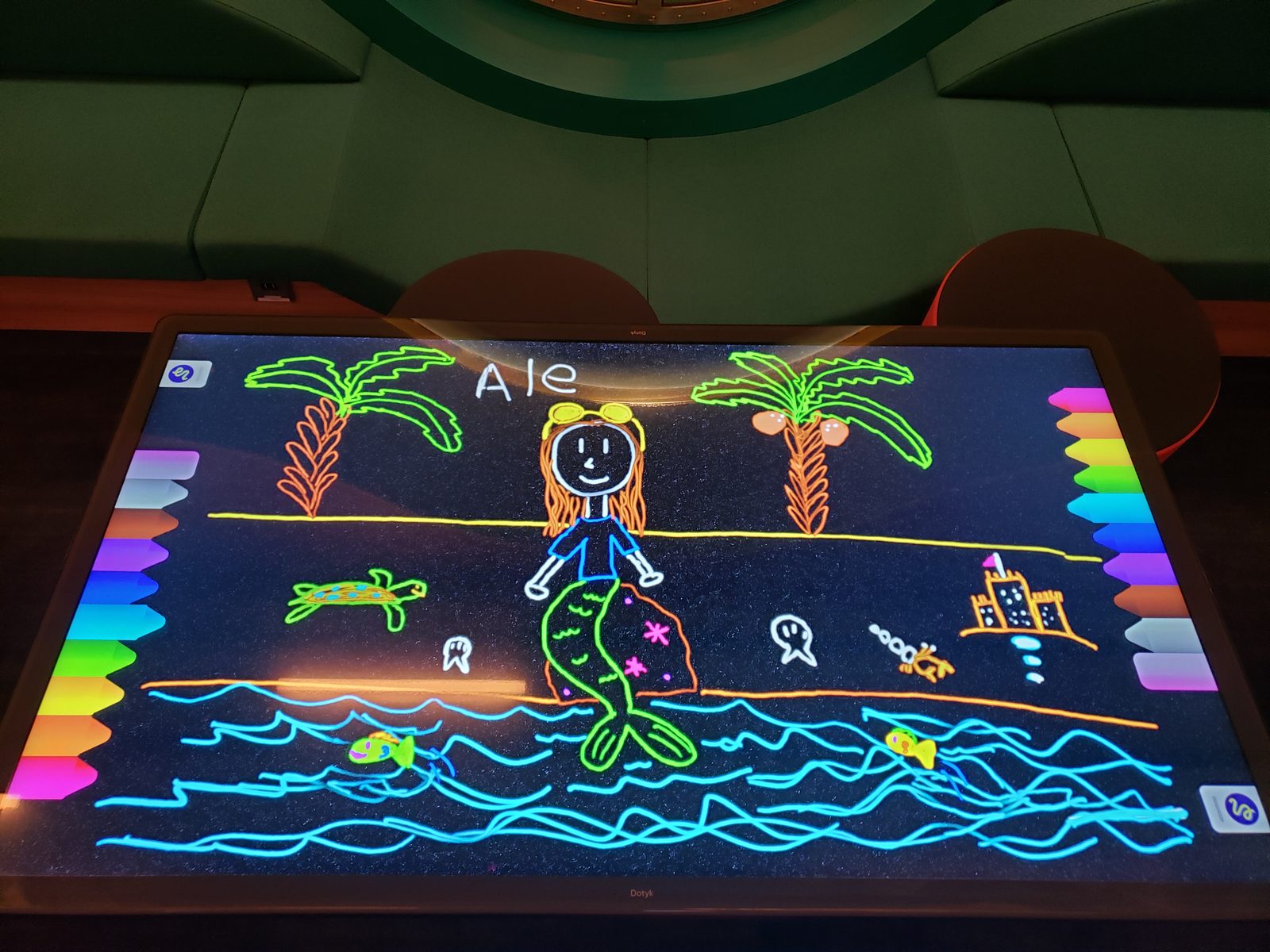 Lisa's mermaid drawing on the glow wall