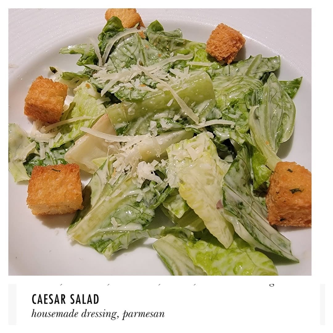 Caesar salad at dinner on the Conquest