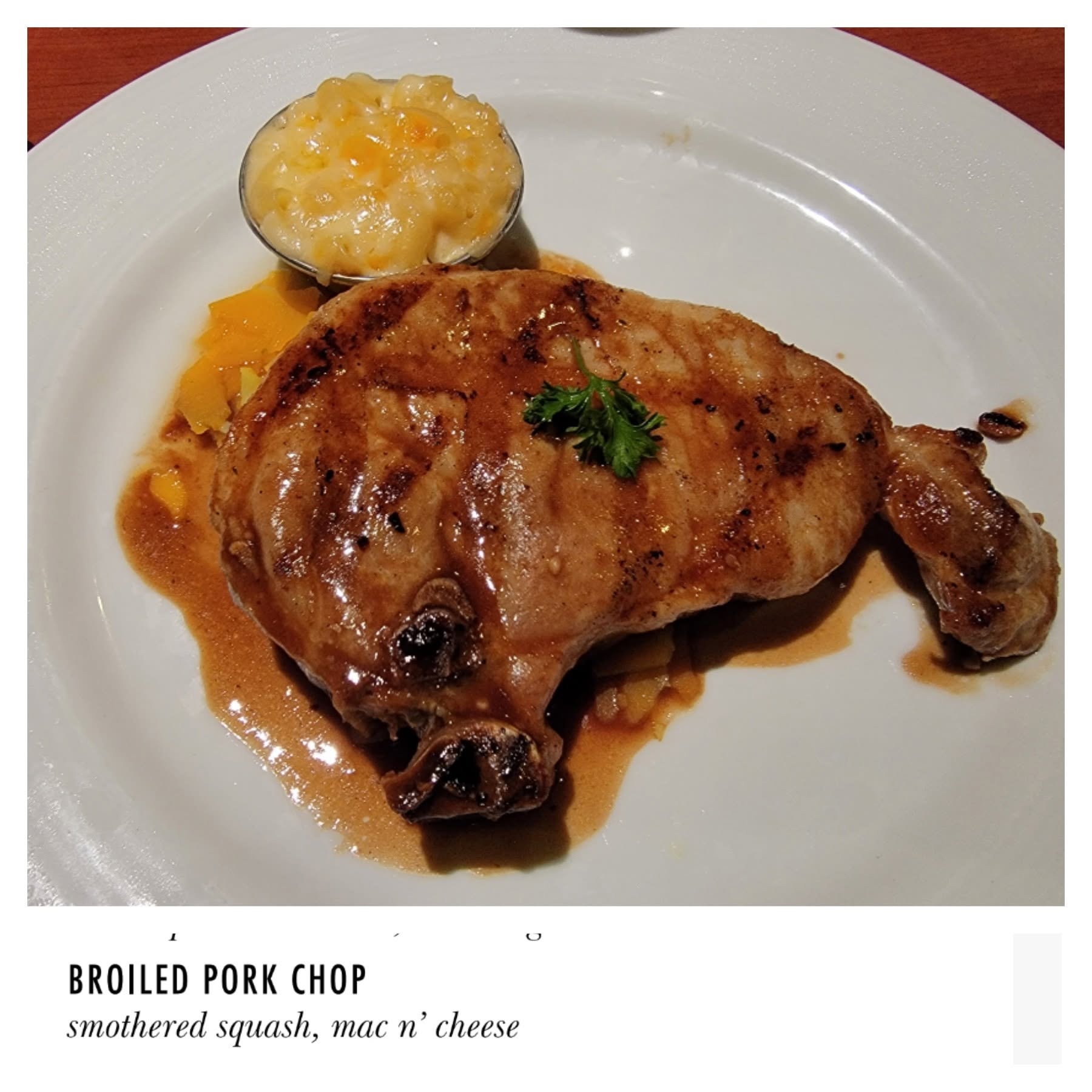 Broiled pork chop at dinner on the Conquest