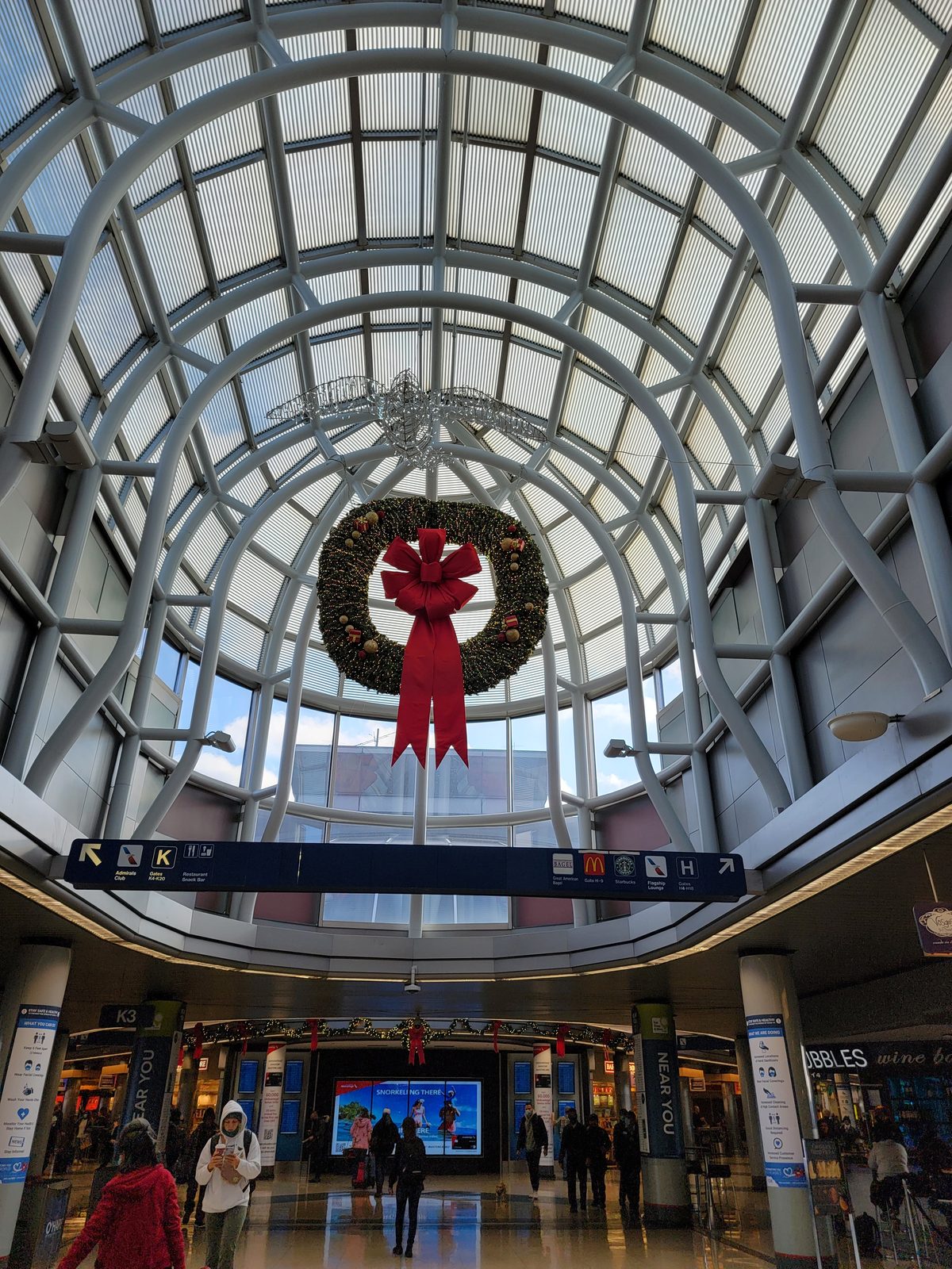 Christmas wreaths hang over the O'Hare terminal