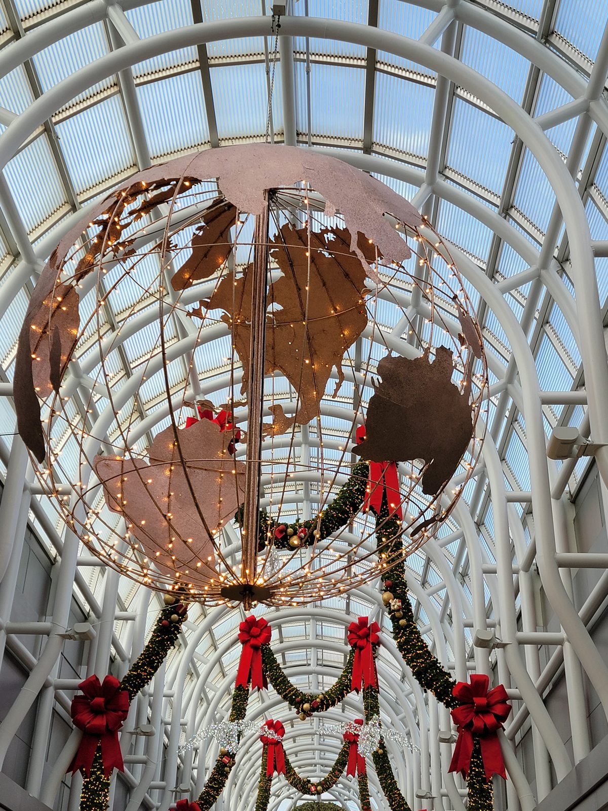 Christmas globe wrapped in wreaths at O'Hare