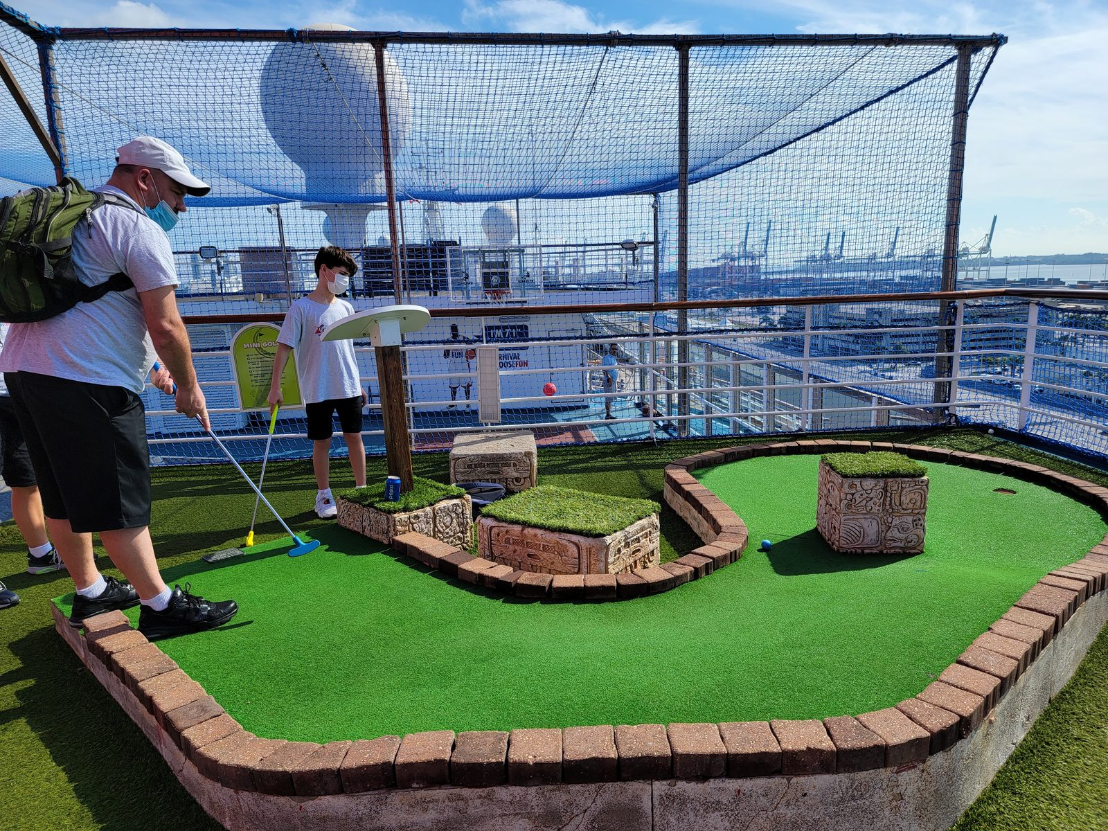 Thomas and I play mini golf on the top deck