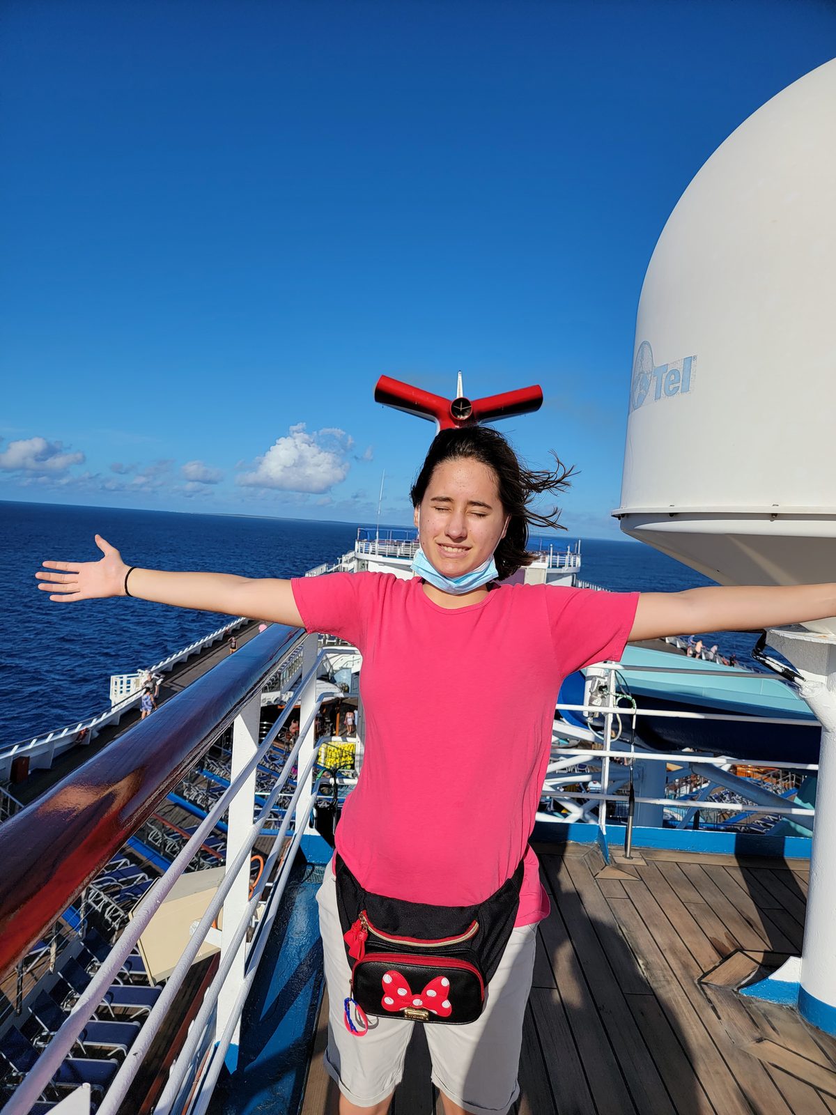 Arms out on deck as we sail in
