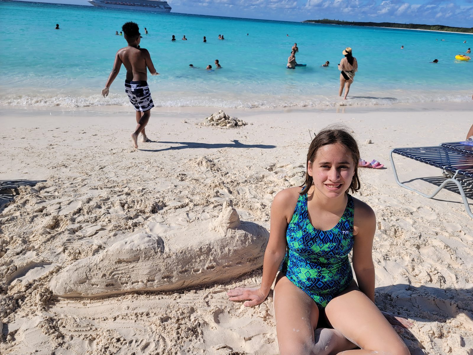 Lisa with her finished sandcastle