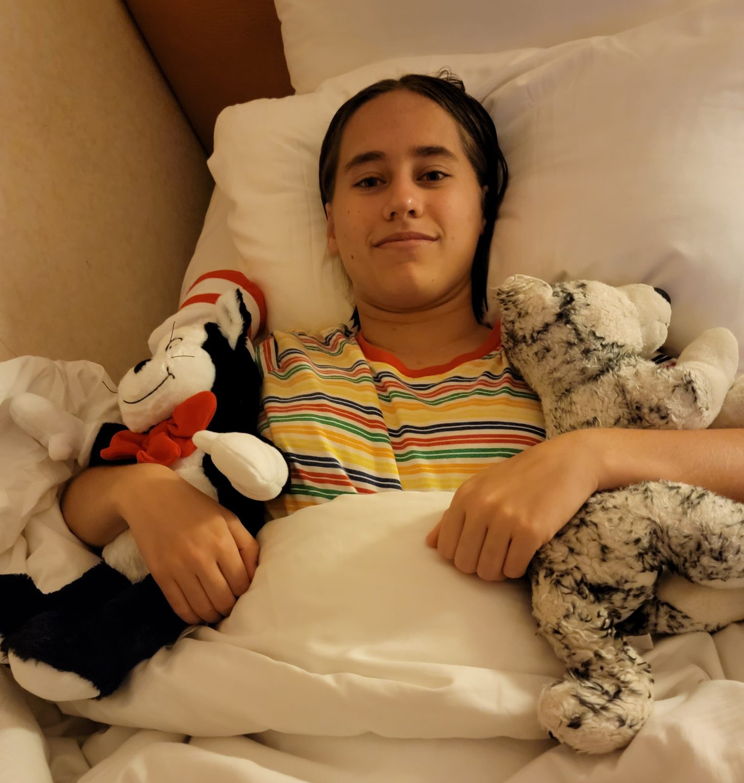 Lisa tucked in with her stuffed animals