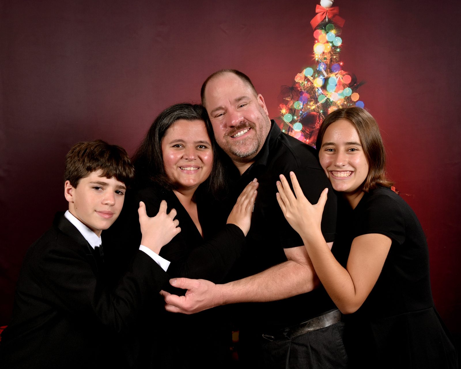 All four of us by the ship's Christmas tree