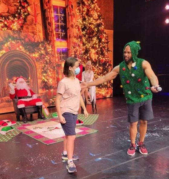 One of the kids called up on stage with Santa