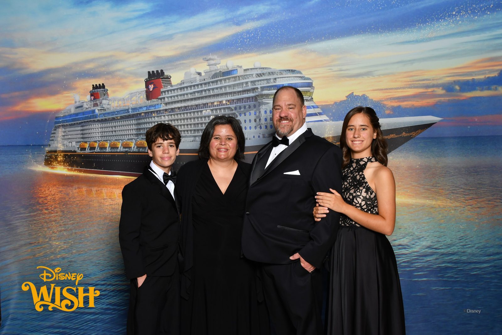 Formal night portrait as a family aboard the Wish