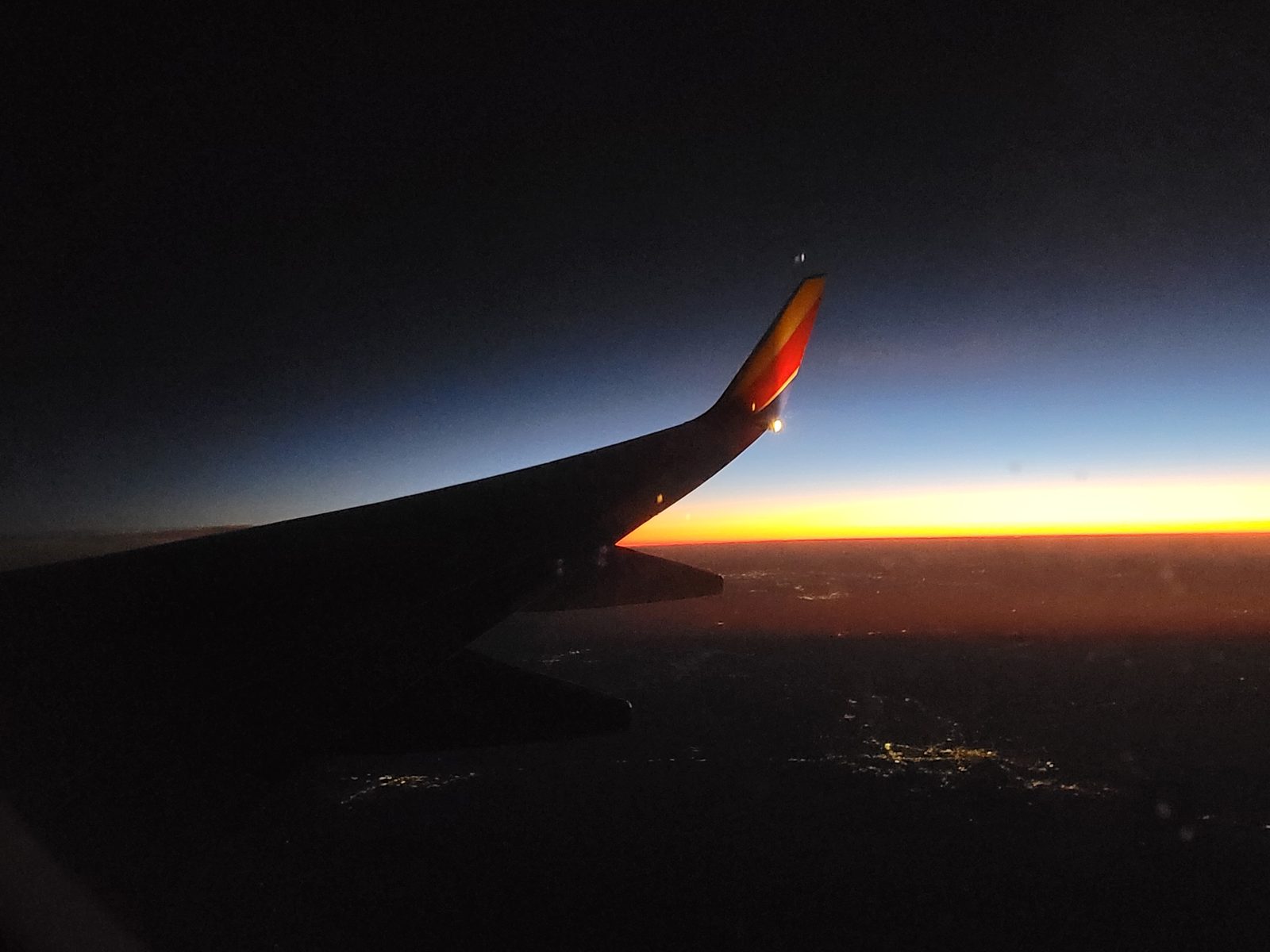 The wing glowing orange as the sun set