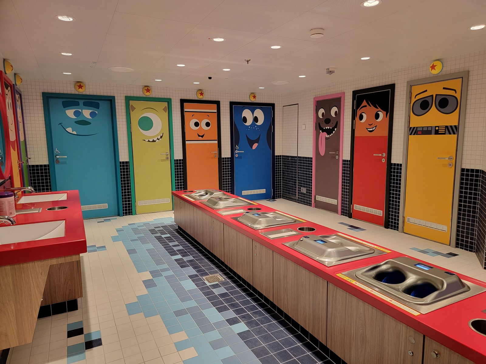A kids' bathroom with character doors on the Wish