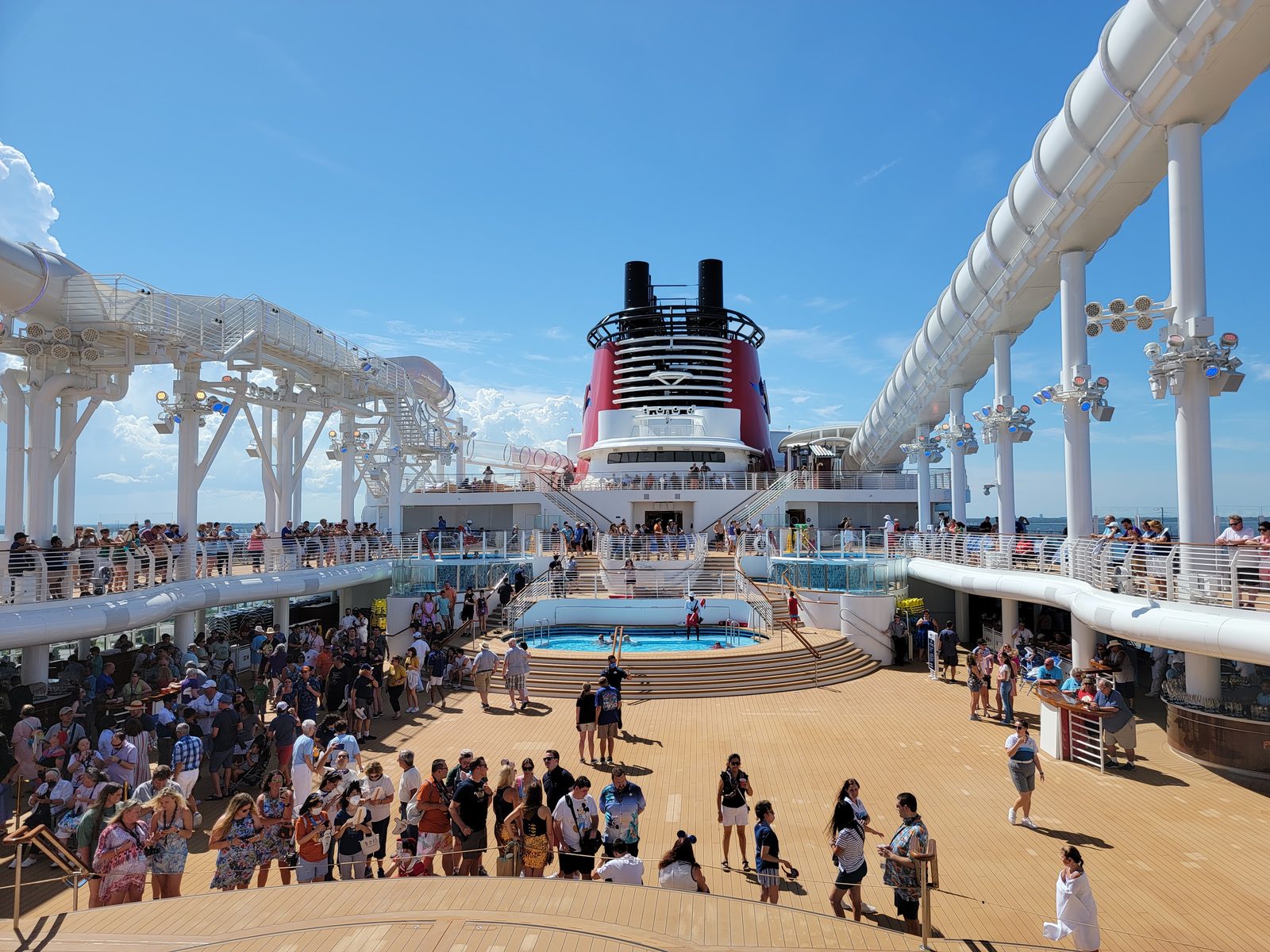 The deck crowd by the AquaMouse slide at sail away