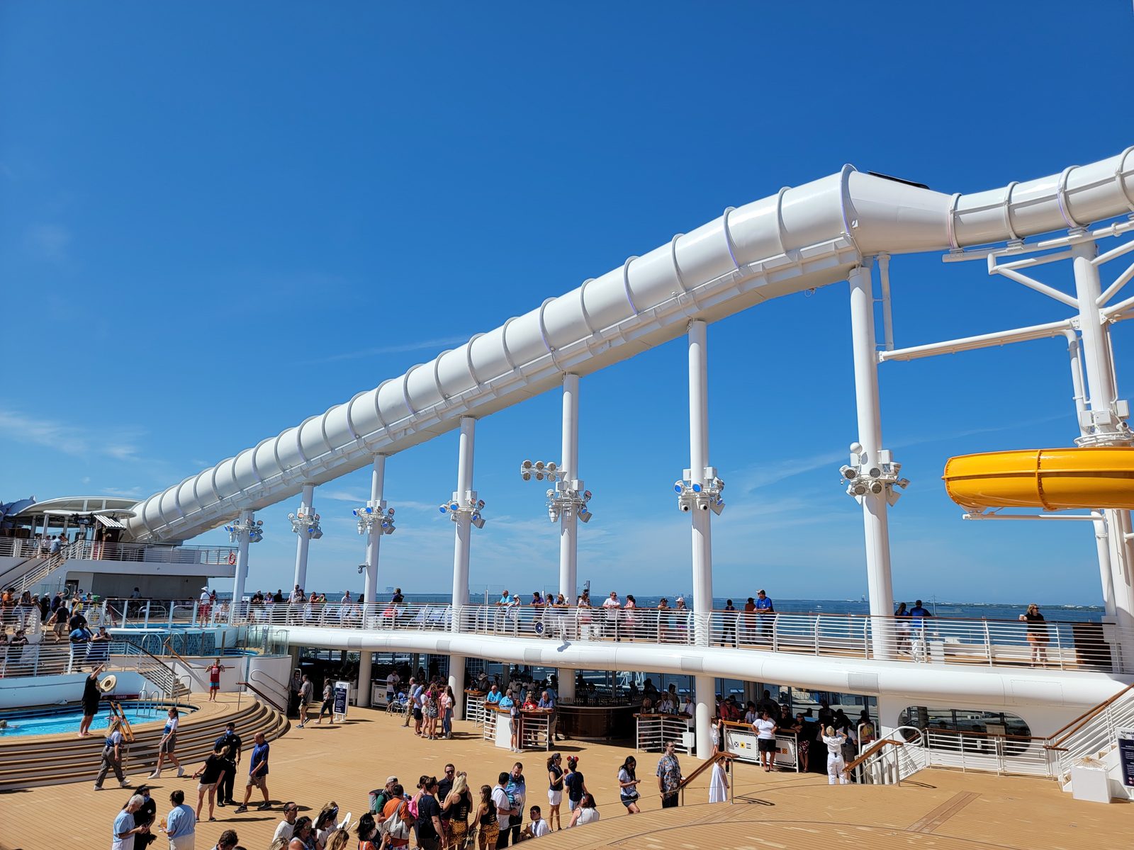 The AquaMouse slide arching over the pool deck