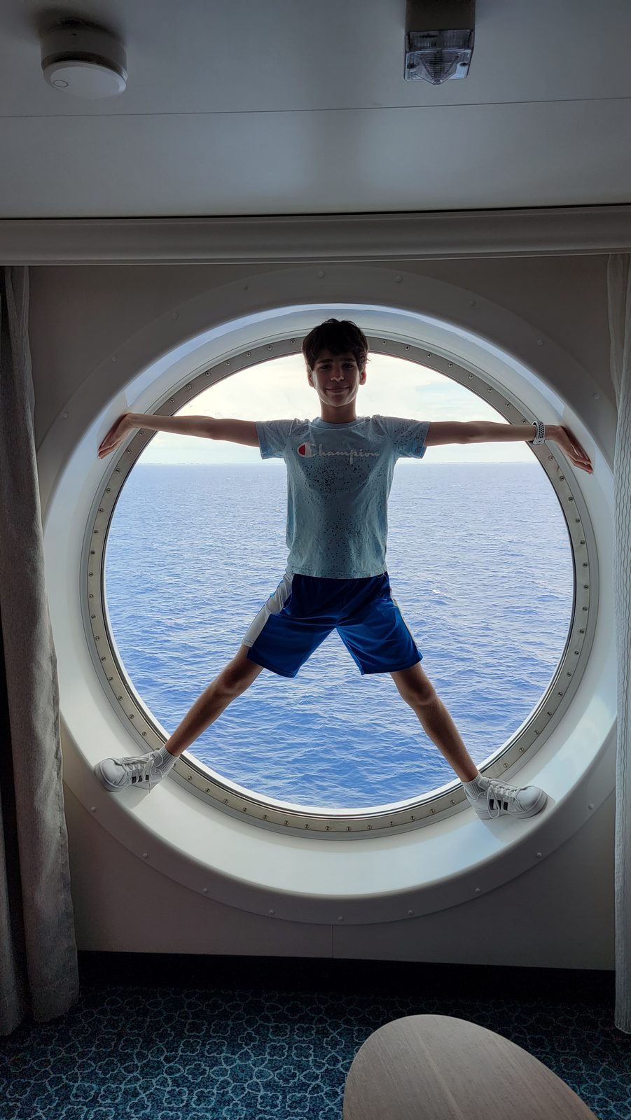Thomas in the stateroom porthole window