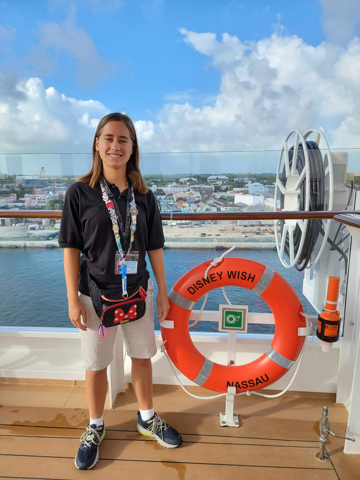 Lisa on deck by the Disney Wish life ring in Nassau