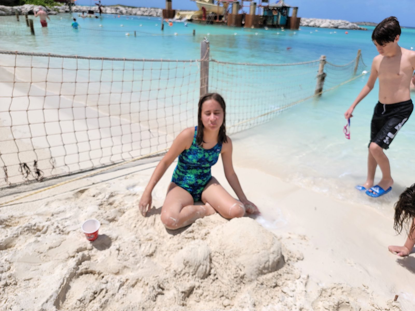 Lisa working on a sandcastle at Castaway Cay