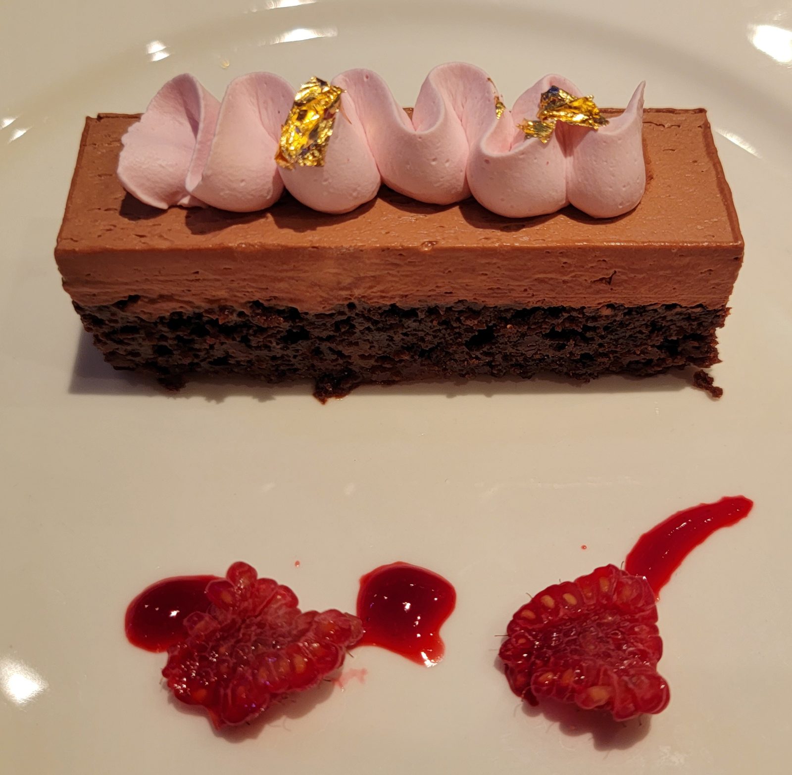 Chocolate dessert topped with gold leaf at Arendelle
