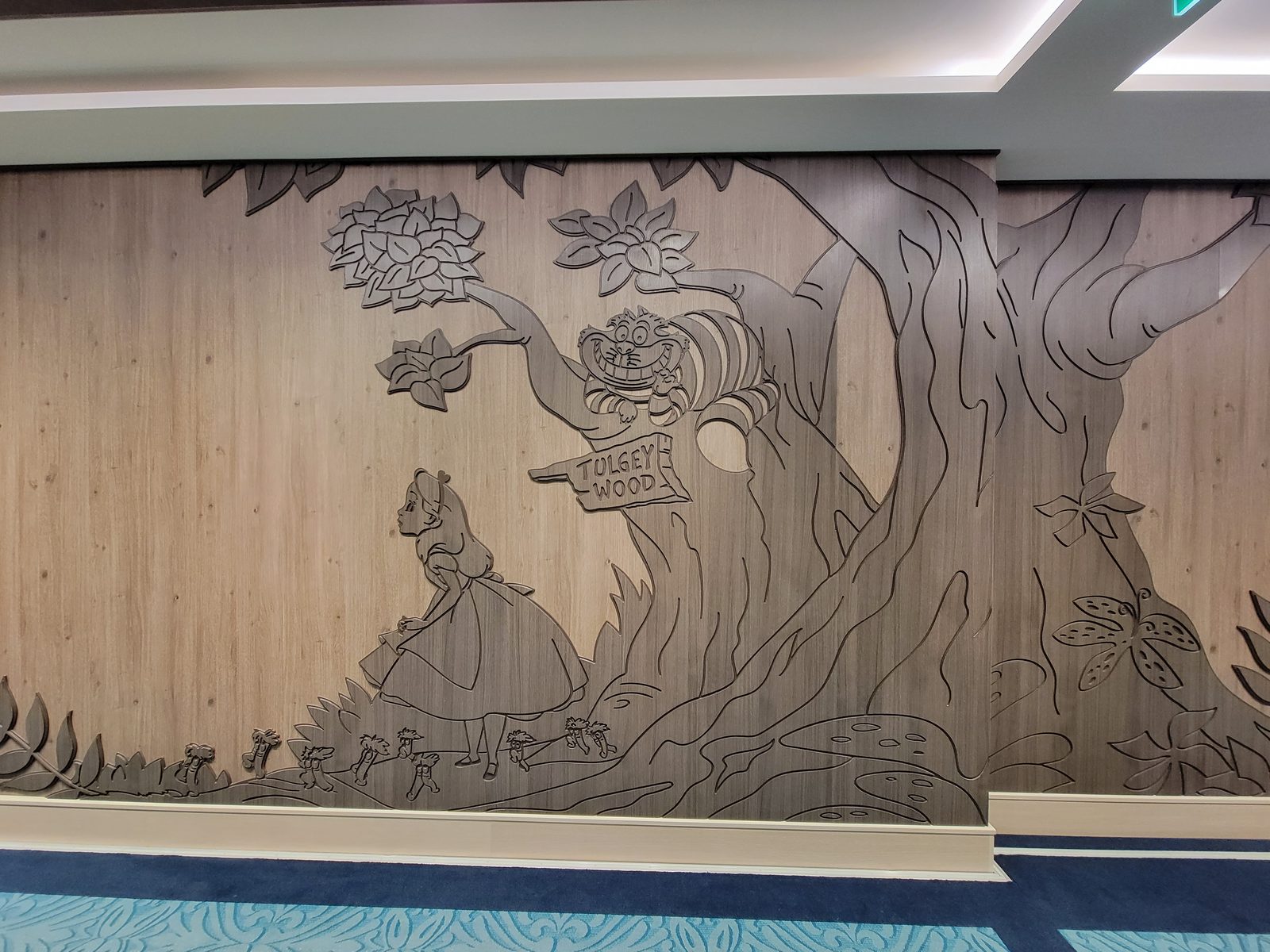 Alice in Wonderland carved into the Tulgey Wood wall