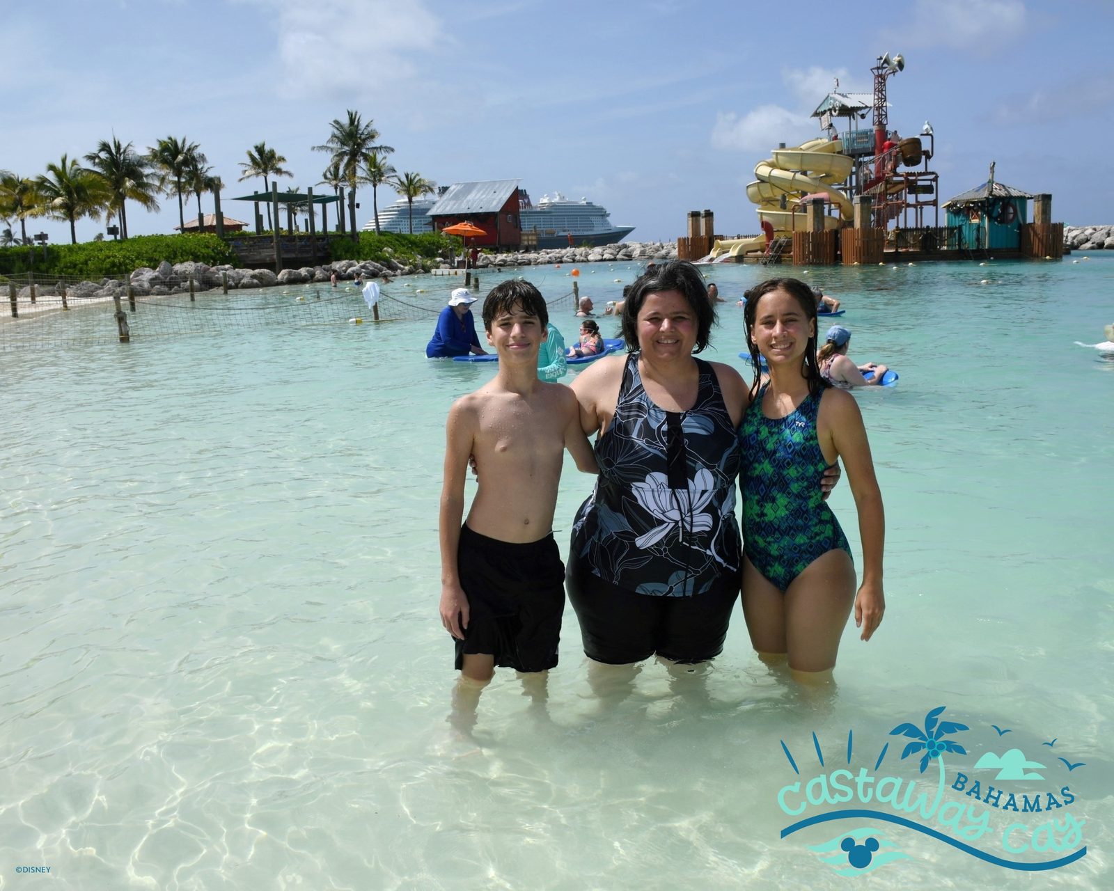 Thomas, Kathy and Lisa wading in the shallows at Castaway Cay