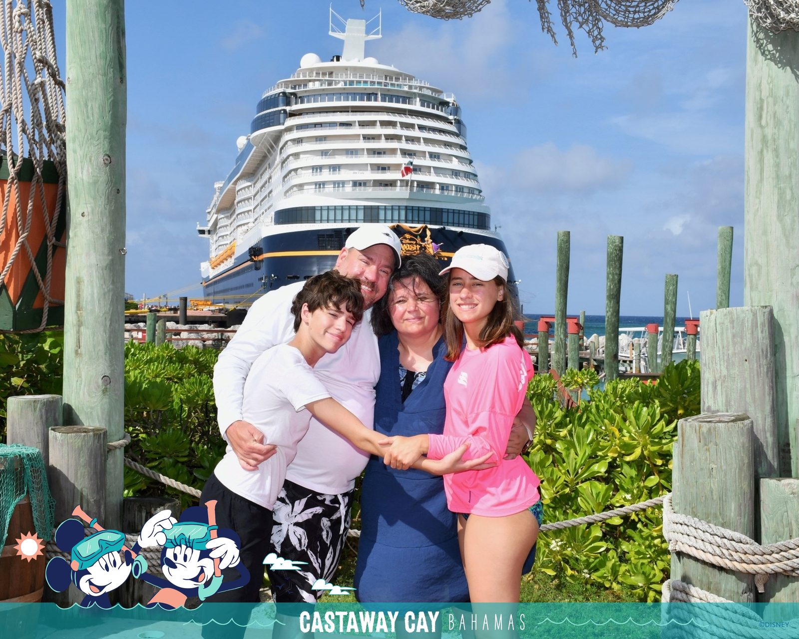 The four of us at Castaway Cay with the Wish docked behind