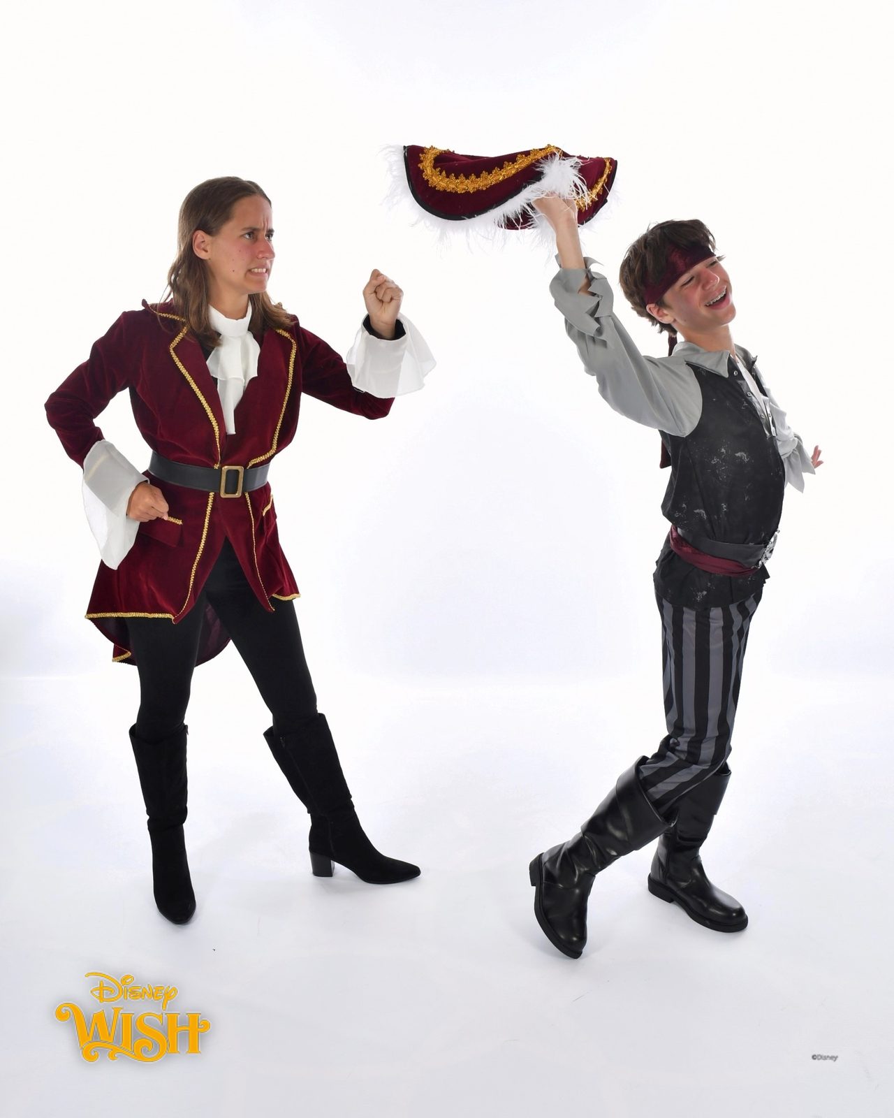 Lisa and Thomas tossing a pirate hat on Pirate Night