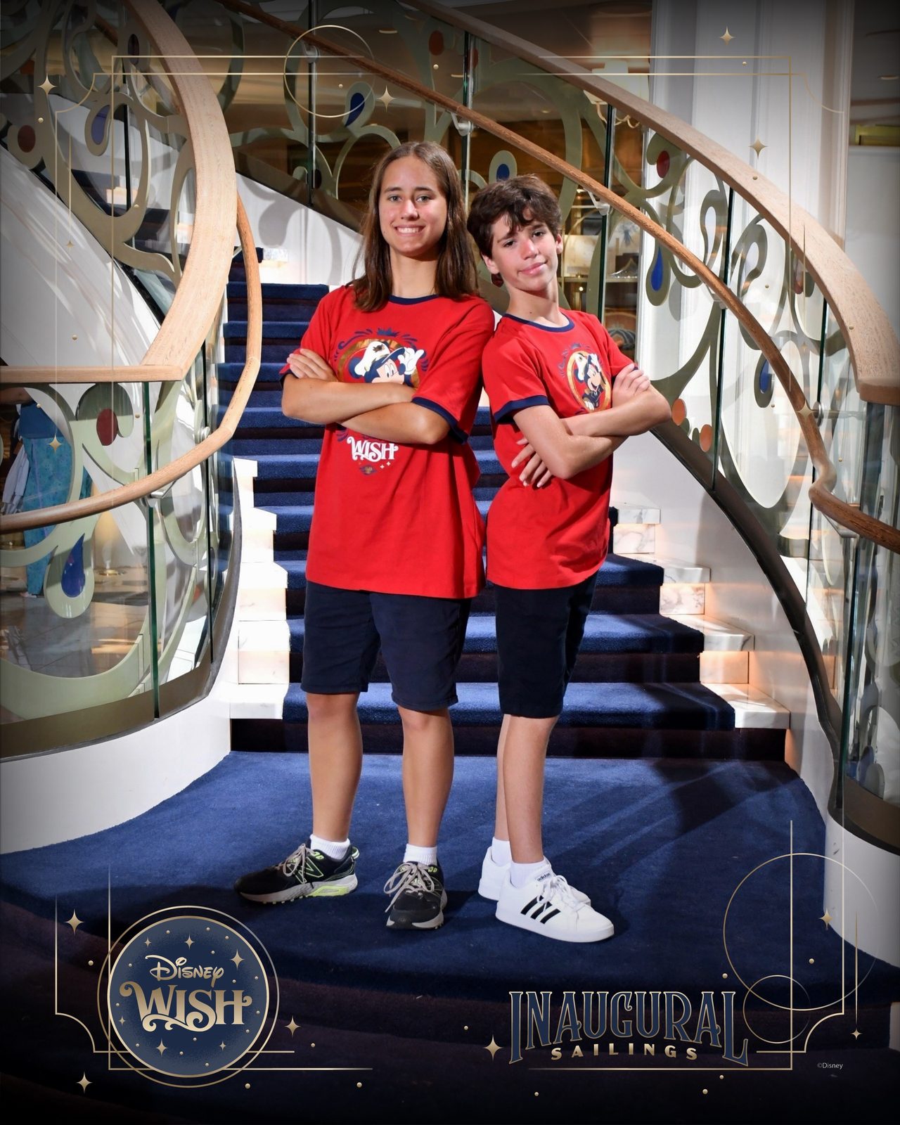 Lisa and Thomas, arms crossed, on the Grand Hall staircase
