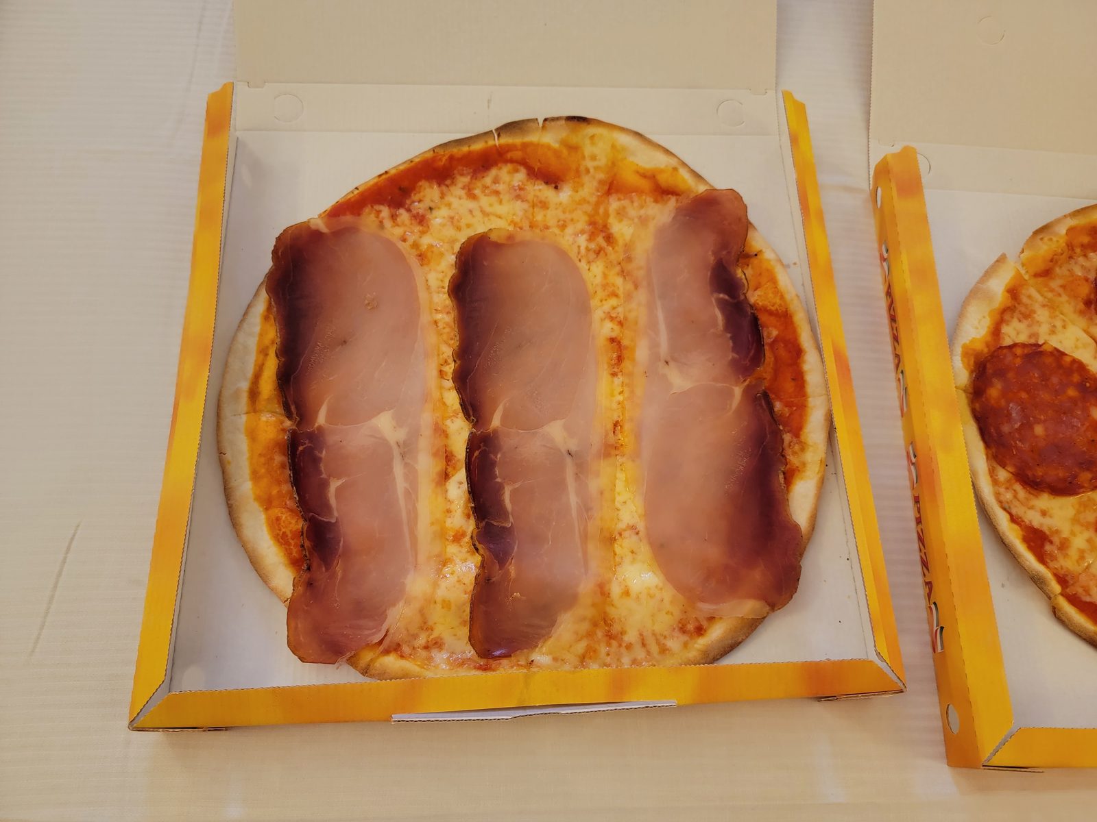 Boxed pizza in the room after the flight