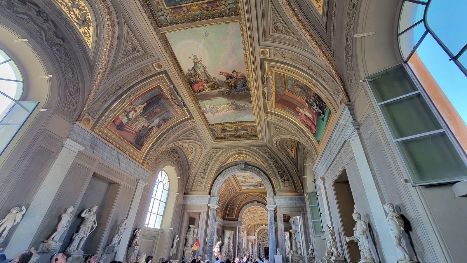 Statues and ceiling paintings in the Vatican Museums