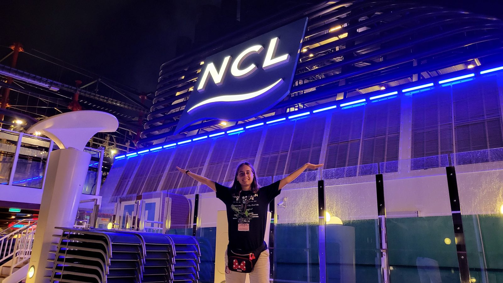 Lisa under the lights of the NCL sign