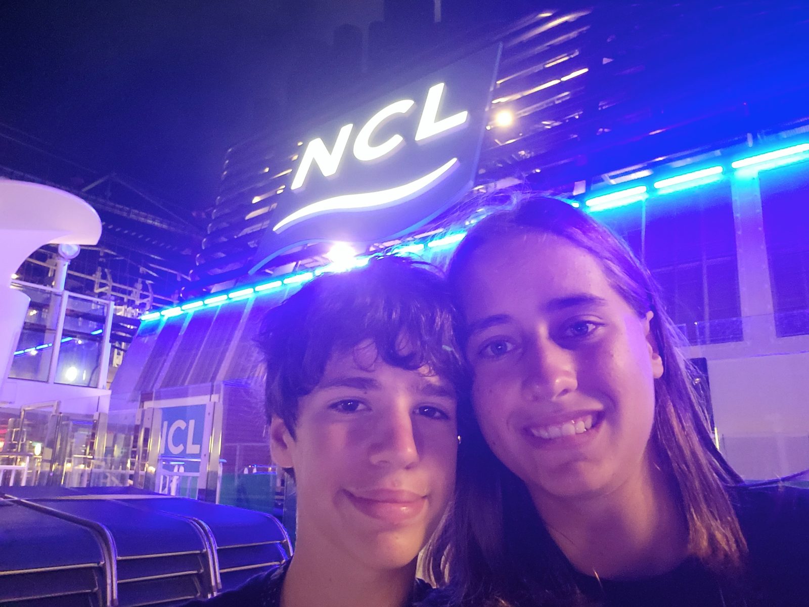 Thomas and Lisa under the lit-up NCL sign