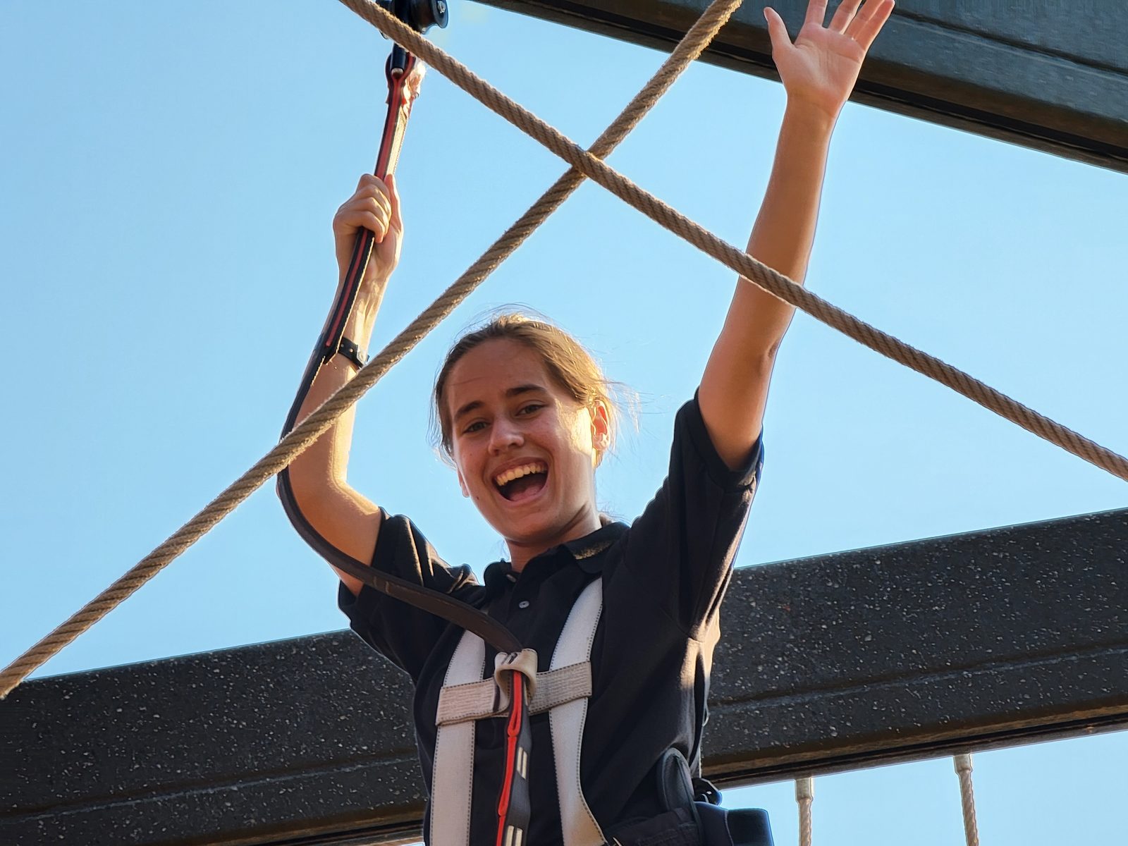 Lisa cheering on the ropes course