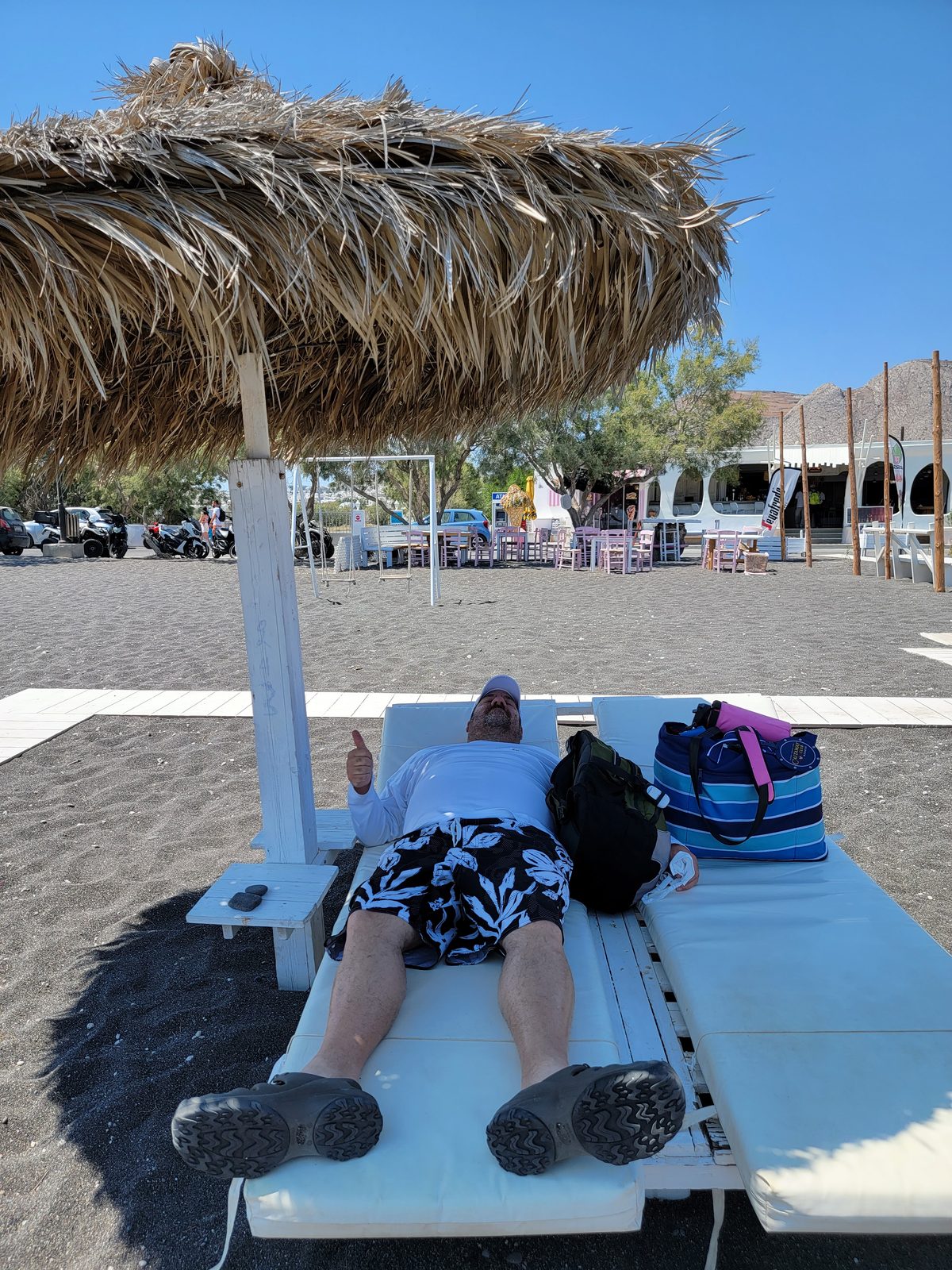 Resting on a sunbed at Perivolos Beach