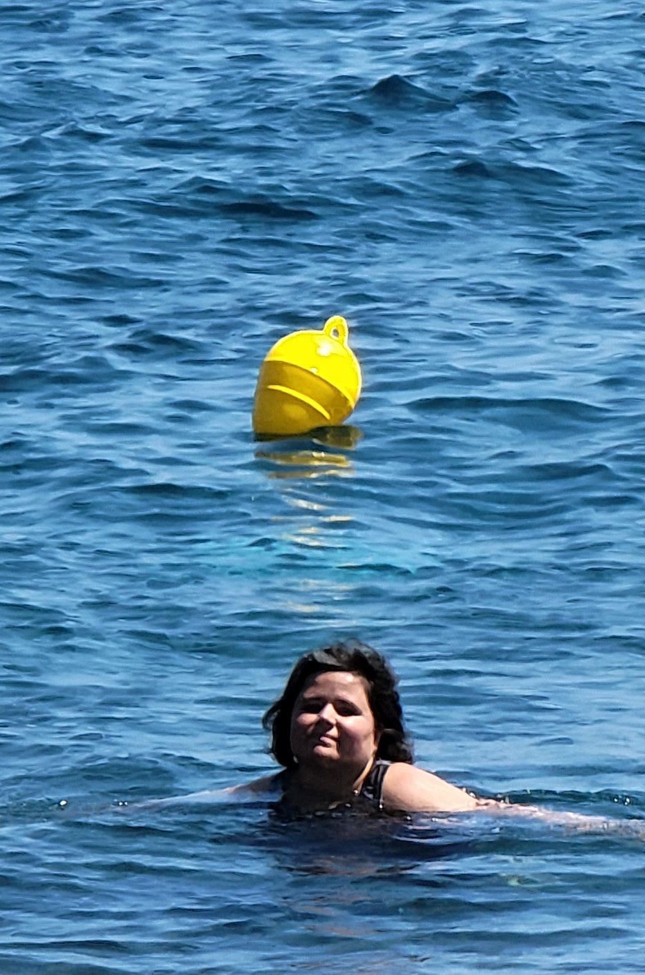 Kathy swimming out toward the yellow buoys