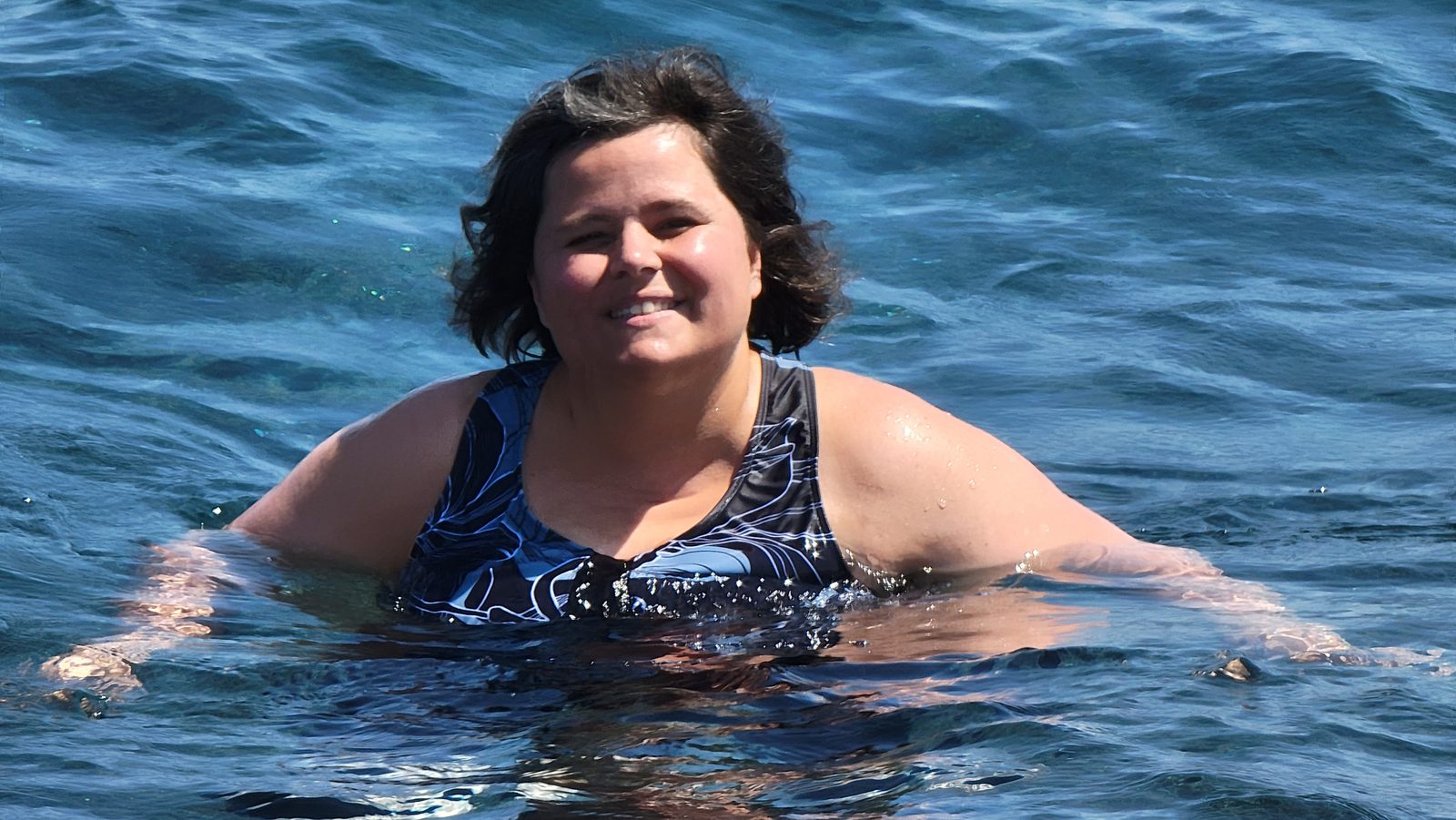 Kathy in the water at Perivolos Beach