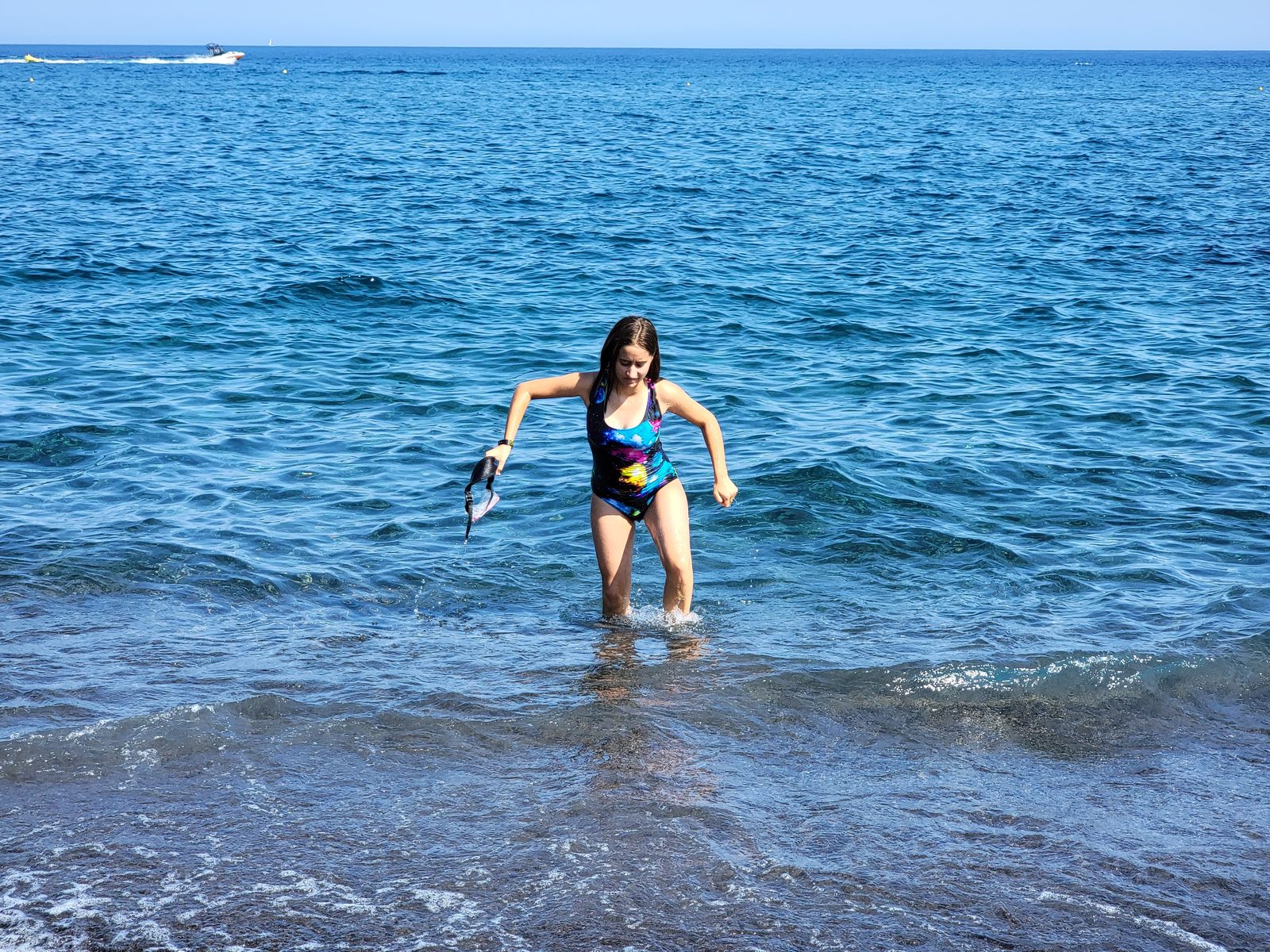Lisa wading in the surf