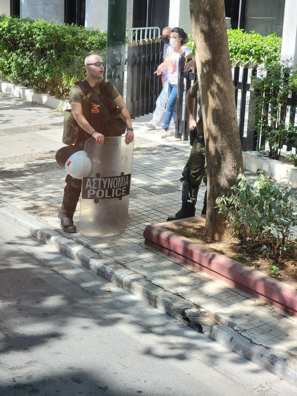 Riot police resting on a street in Athens