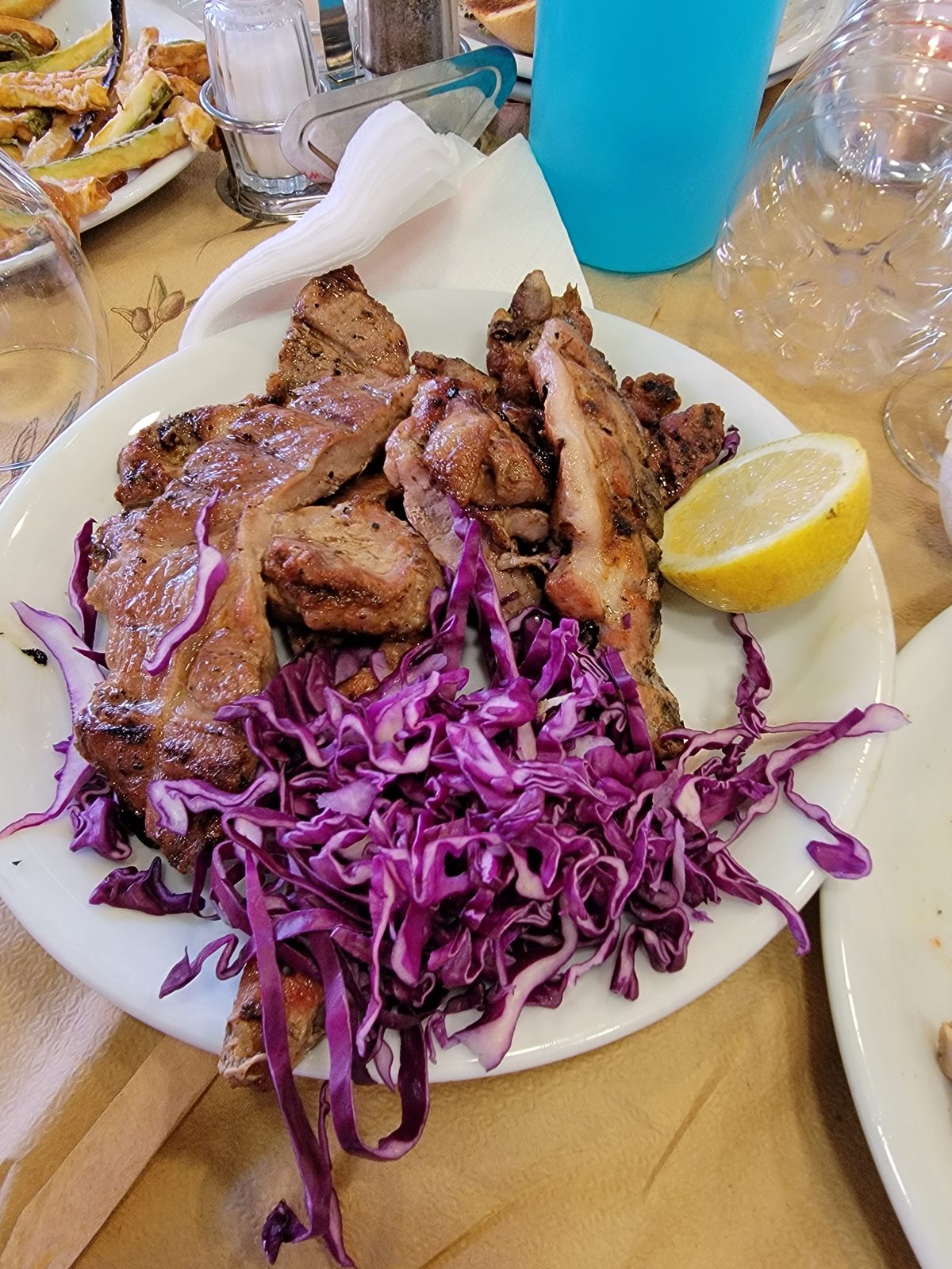 Grilled meat and red cabbage at Taverna Mourouzis