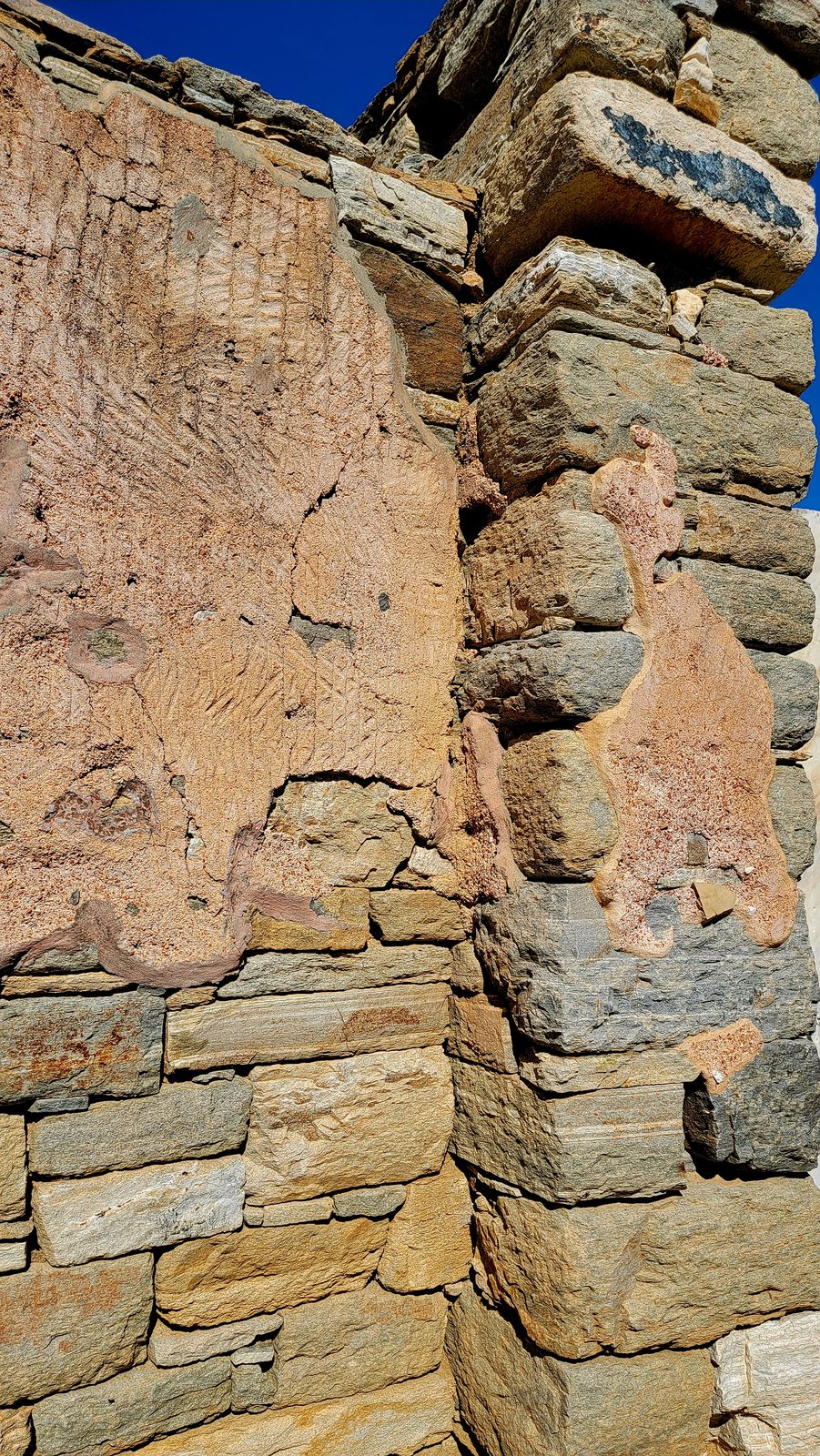 Old painted plaster on a wall on Delos