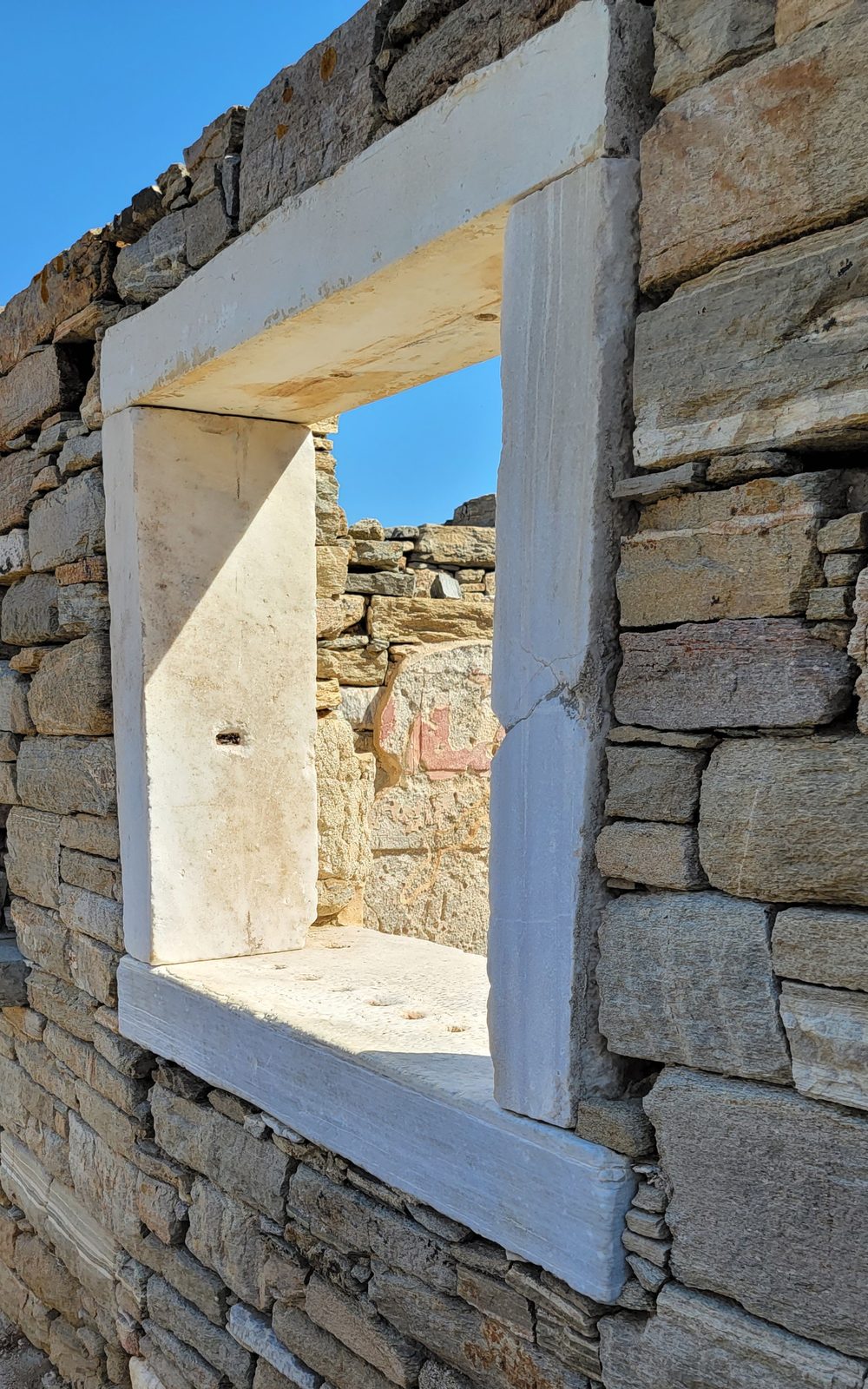 A marble window frame on Delos