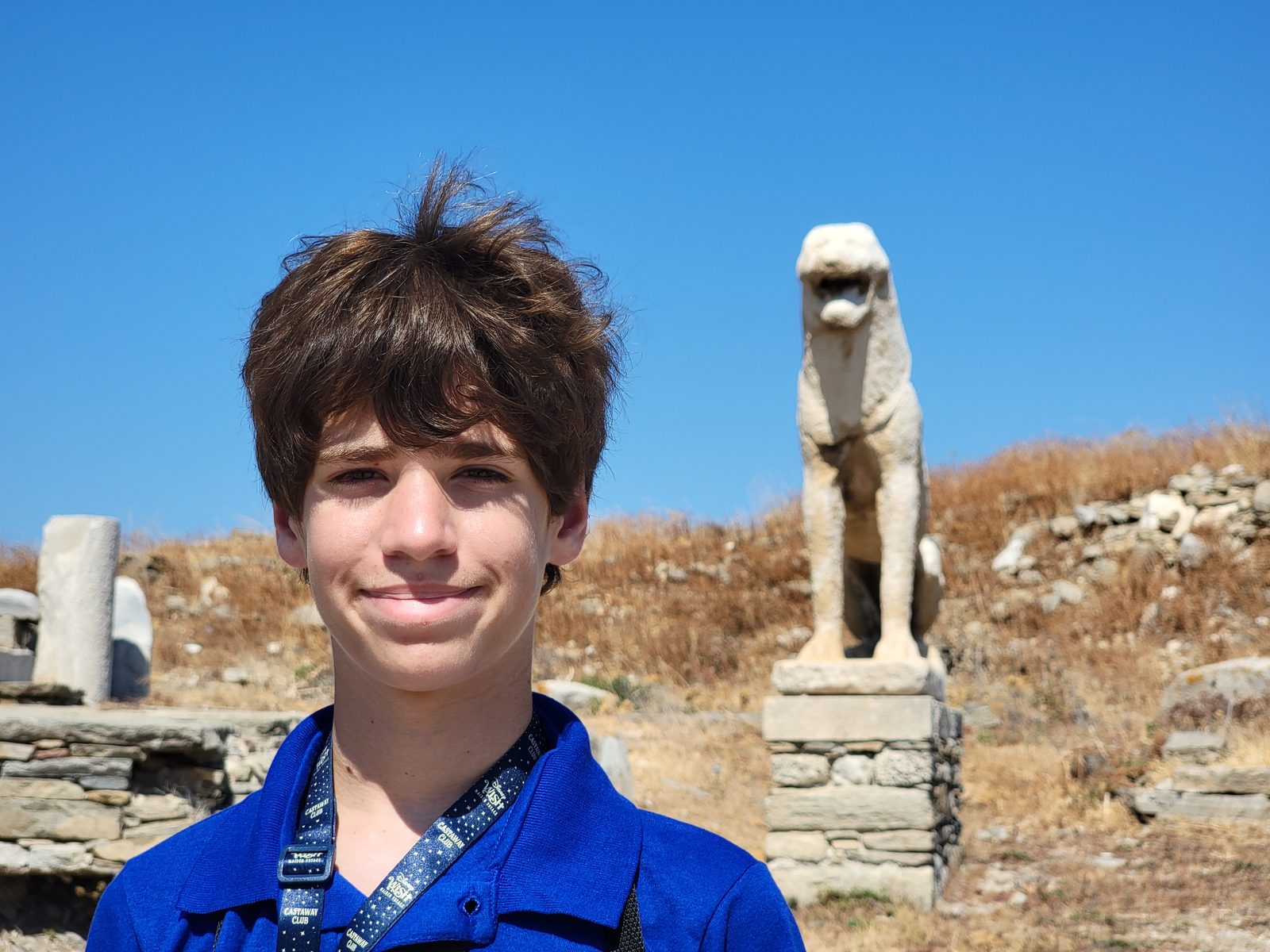 Thomas beside a marble lion