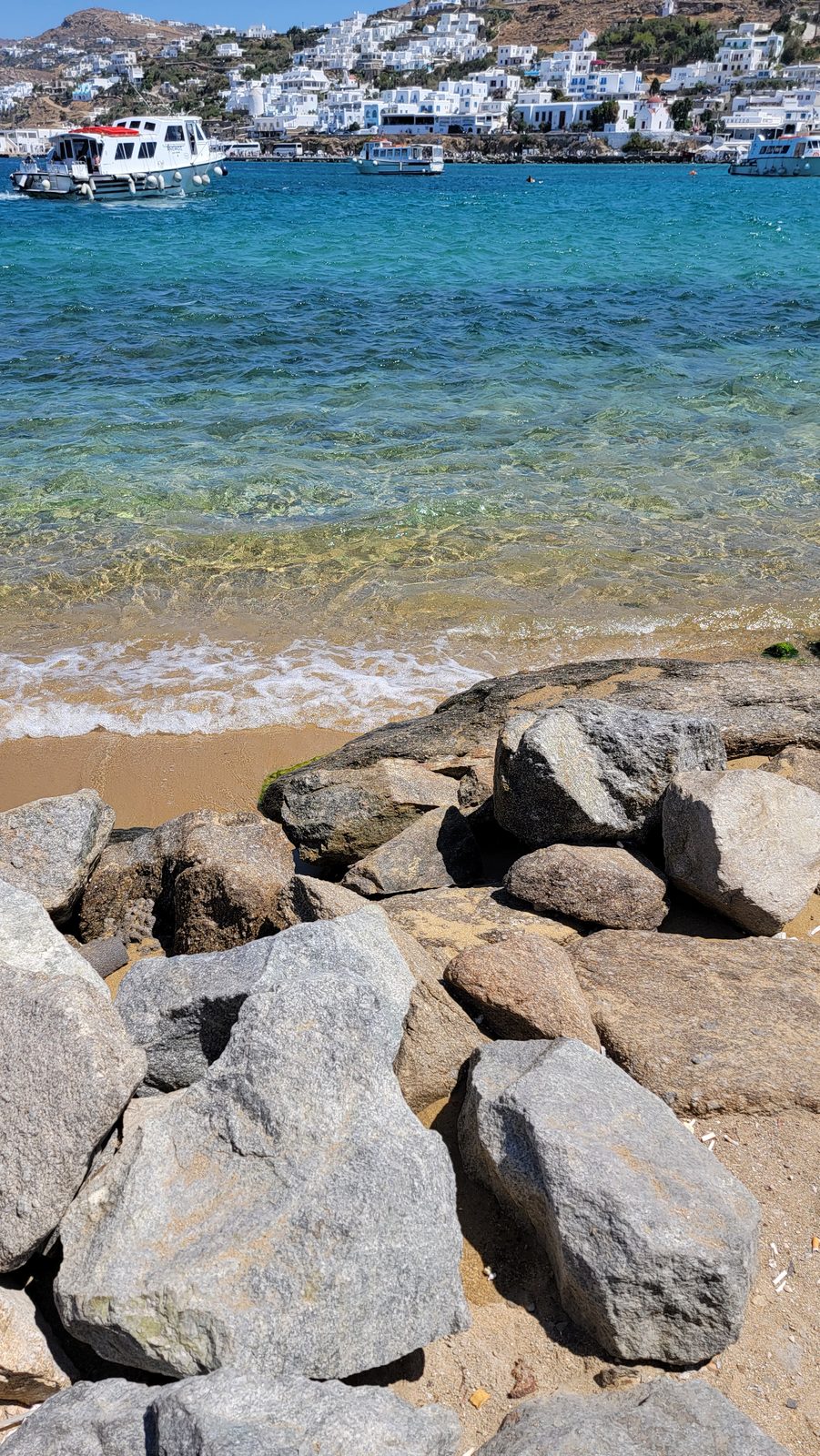 Clear water by the rocks in Mykonos