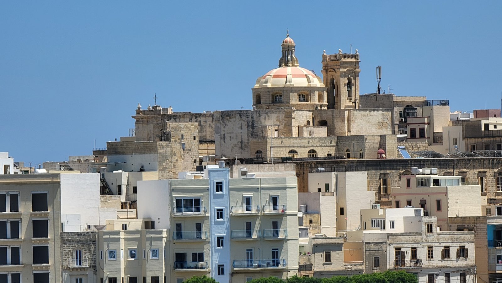 Valletta rooftops and a church dome from the ship