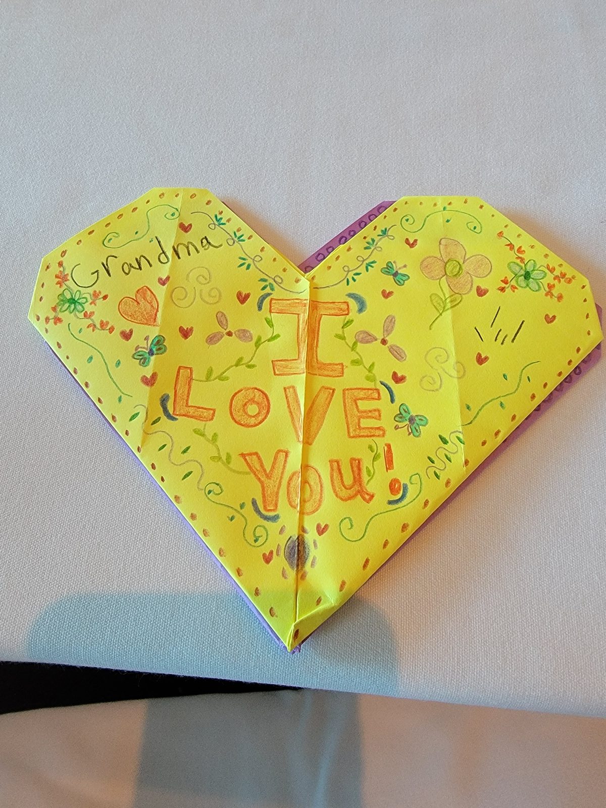 A paper heart for Grandma at dinner