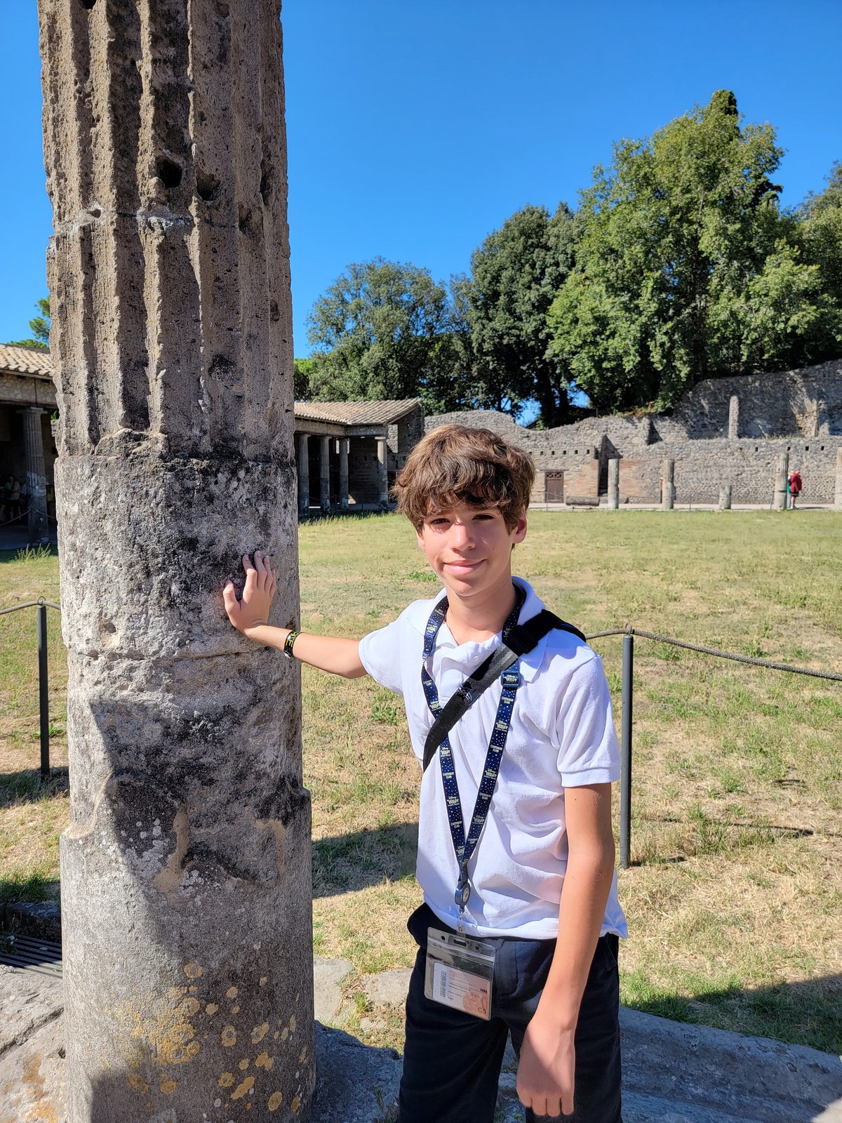 Thomas beside a column at Pompeii