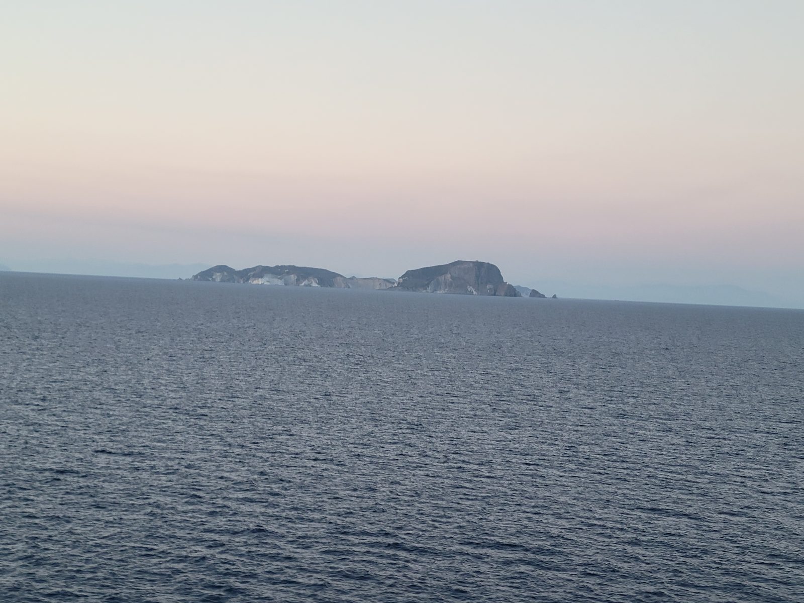 Sunset over an island after Naples