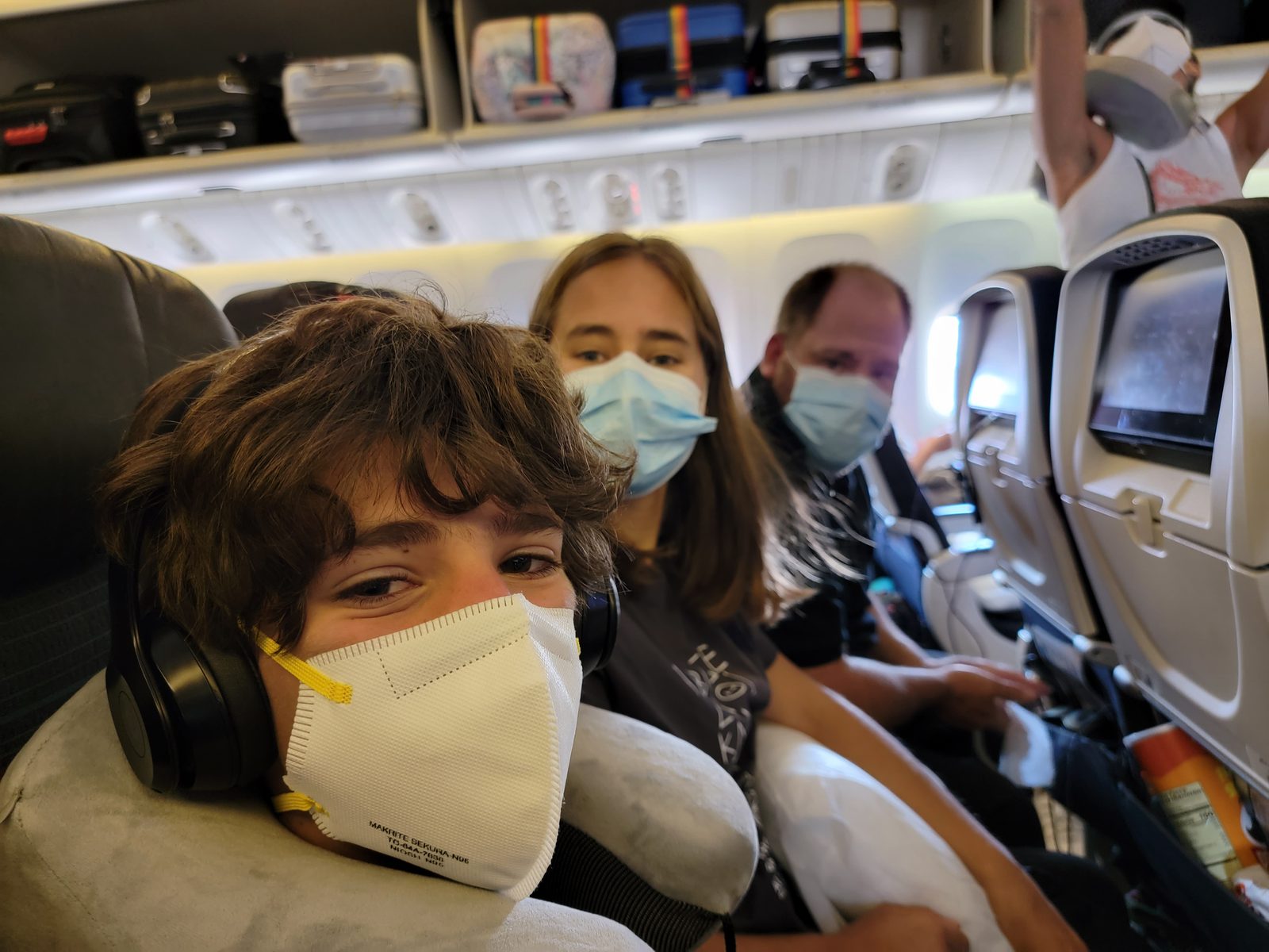 Thomas, Lisa and Michael masked up for the flight home