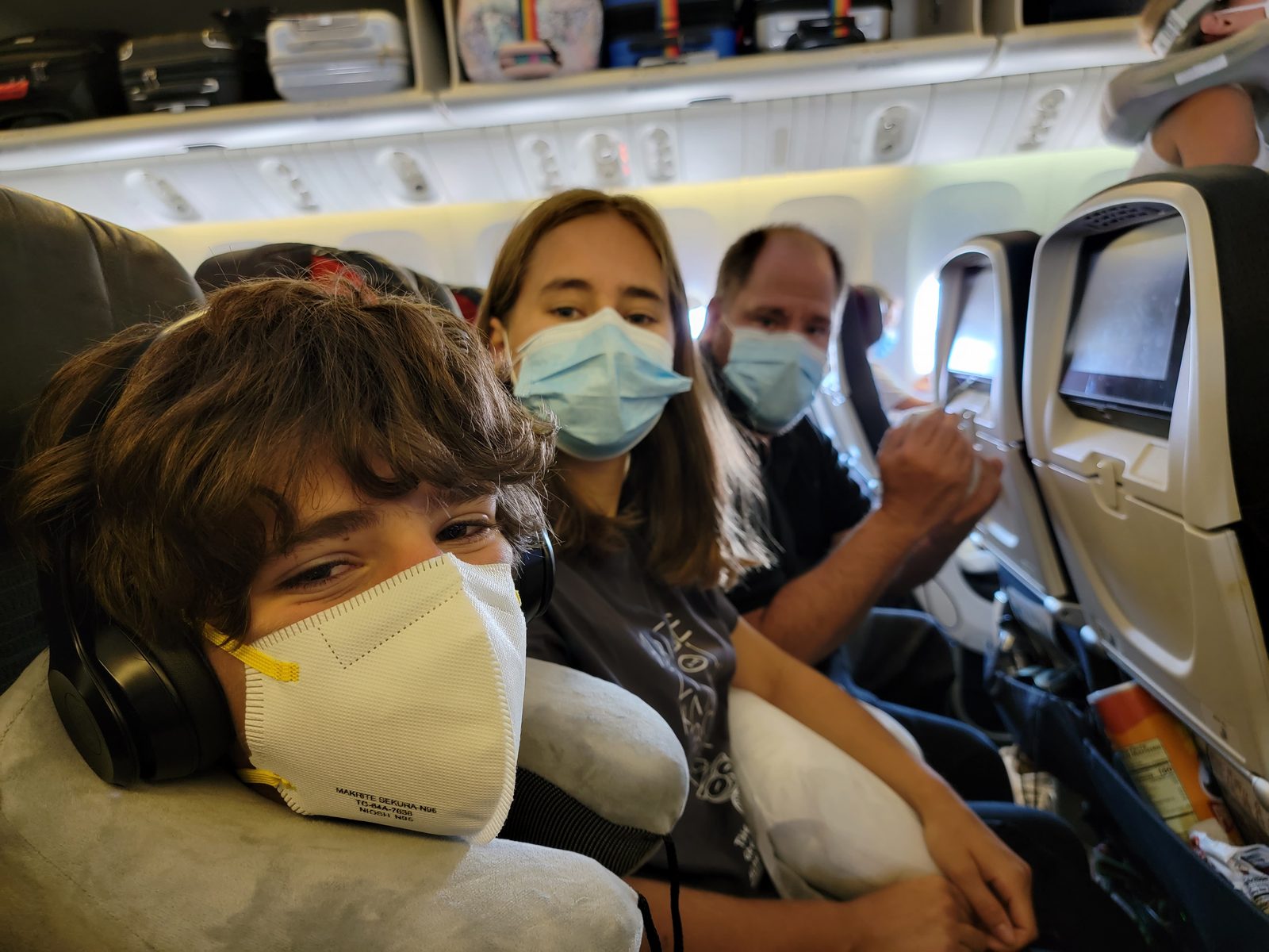 Thomas, Lisa and me masked on the flight home