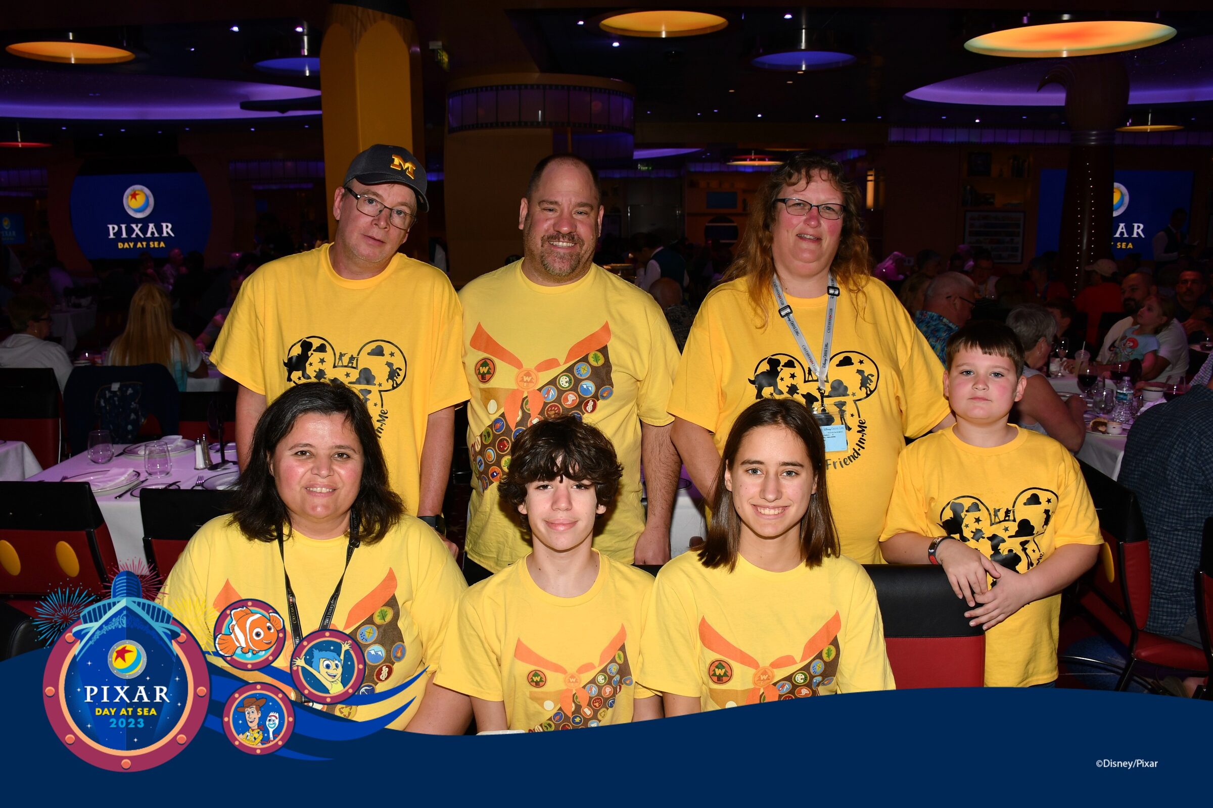 The whole group in matching Pixar Day shirts