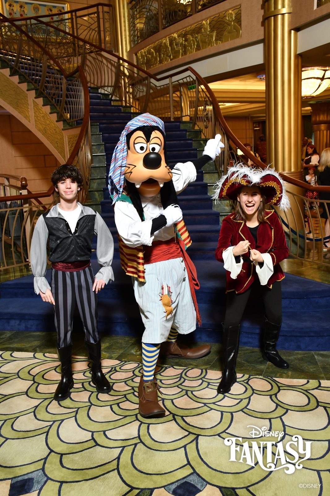 Thomas, Goofy in pirate garb and Lisa on Pirate Night in the Lobby Atrium